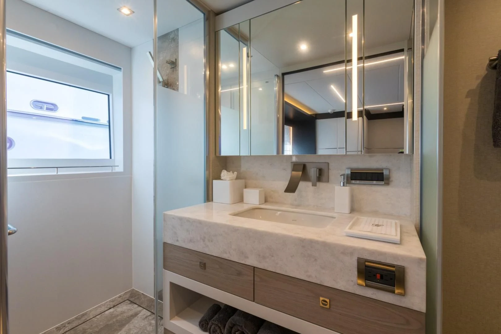 a bathroom with a large mirror aboard GG Yacht for Sale