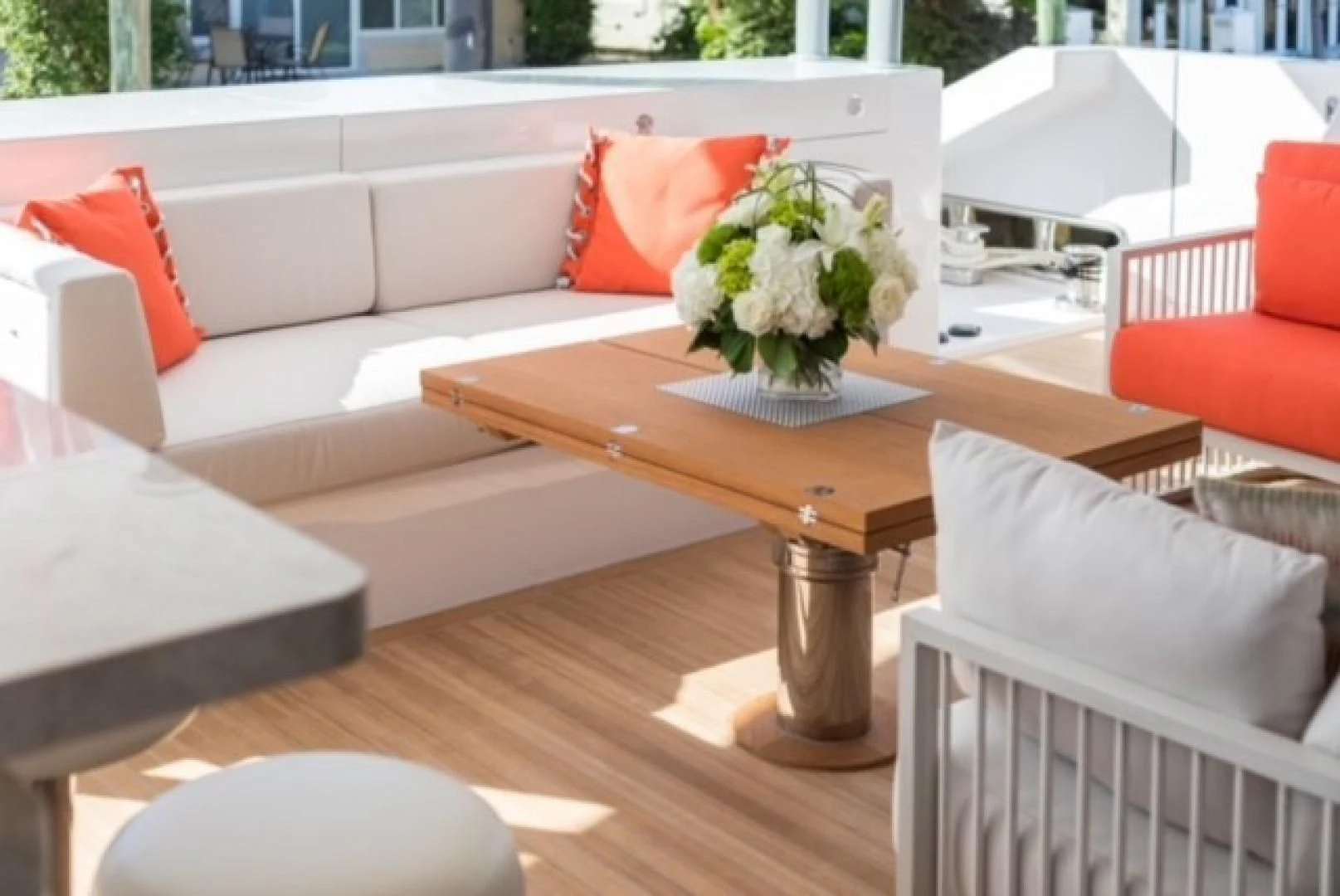 a table with chairs and a couch aboard GG Yacht for Sale