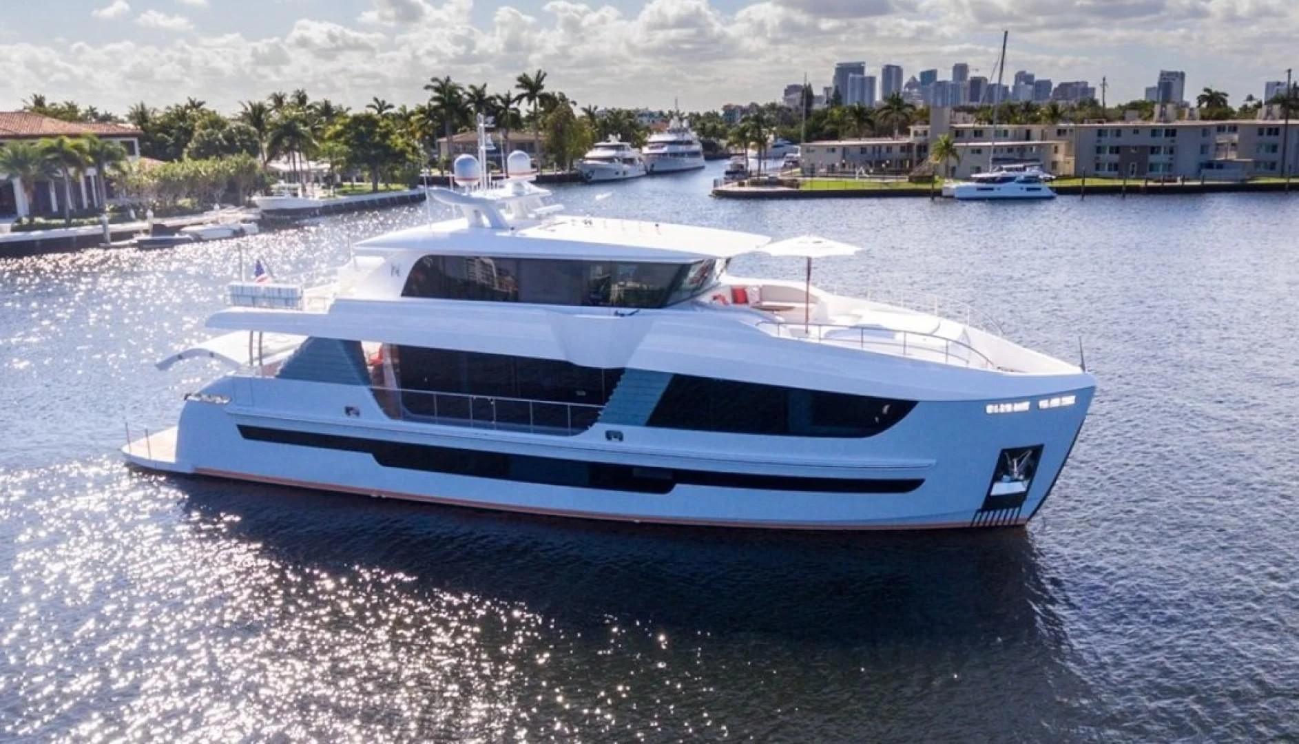 a white yacht in the water aboard GG Yacht for Sale
