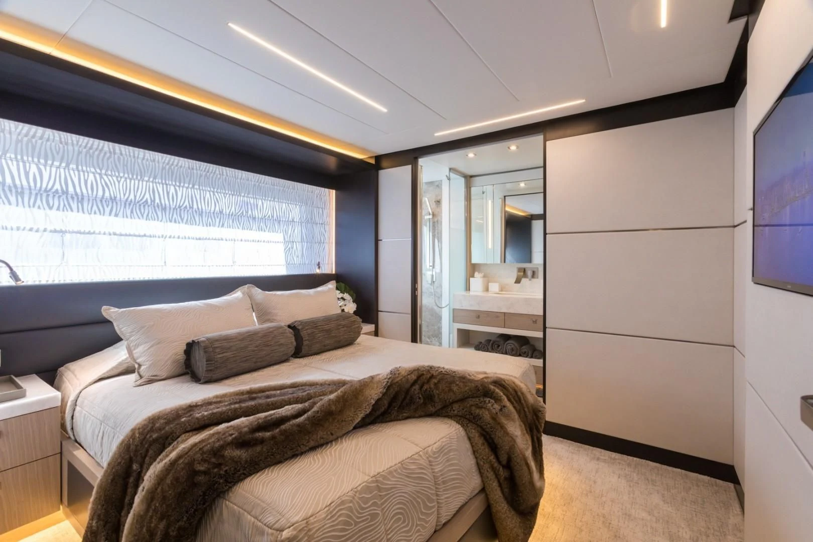 a bedroom with a large bed aboard GG Yacht for Sale