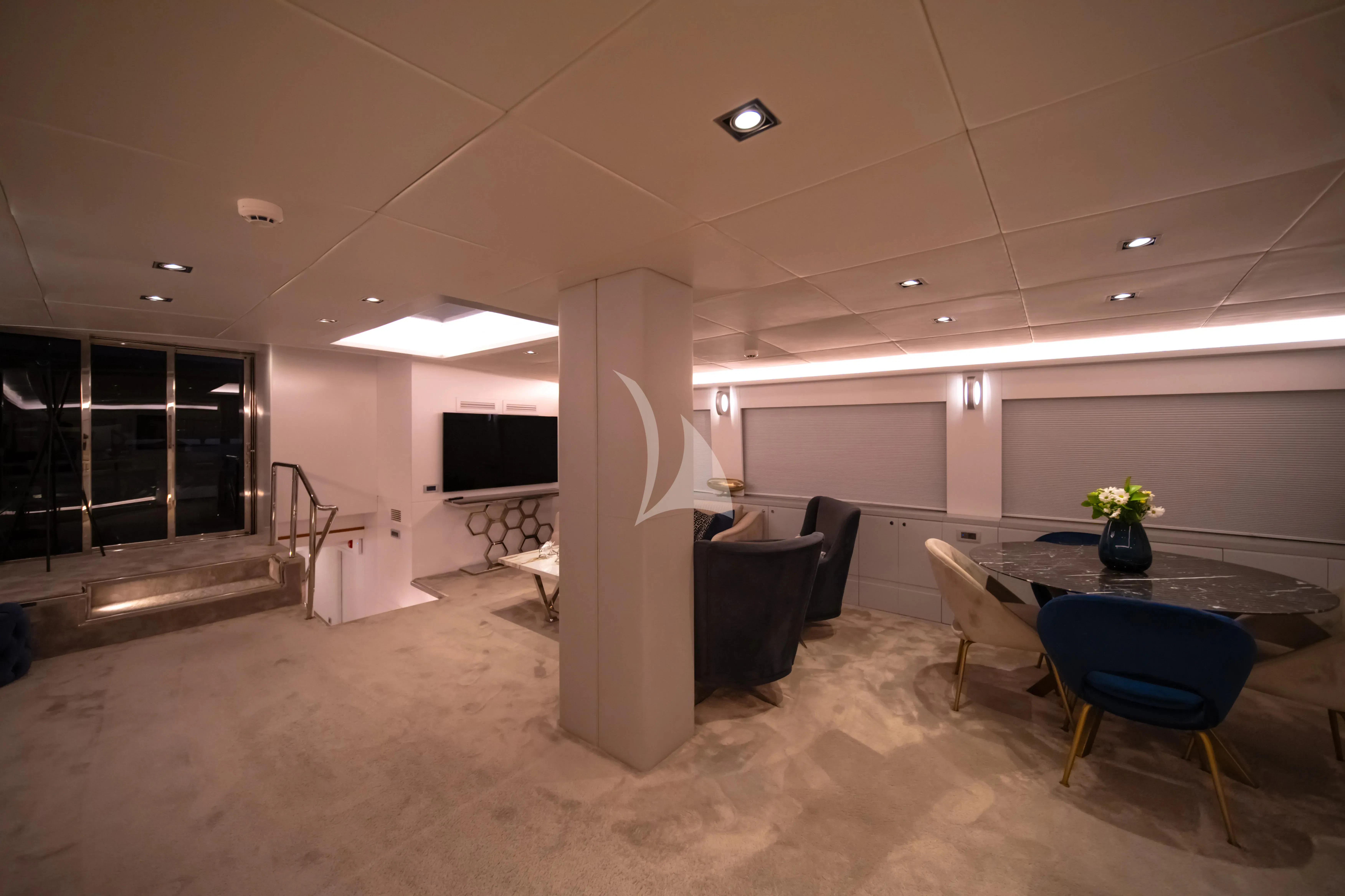 a room with tables and chairs aboard DOUBLE EAGLE Yacht for Sale