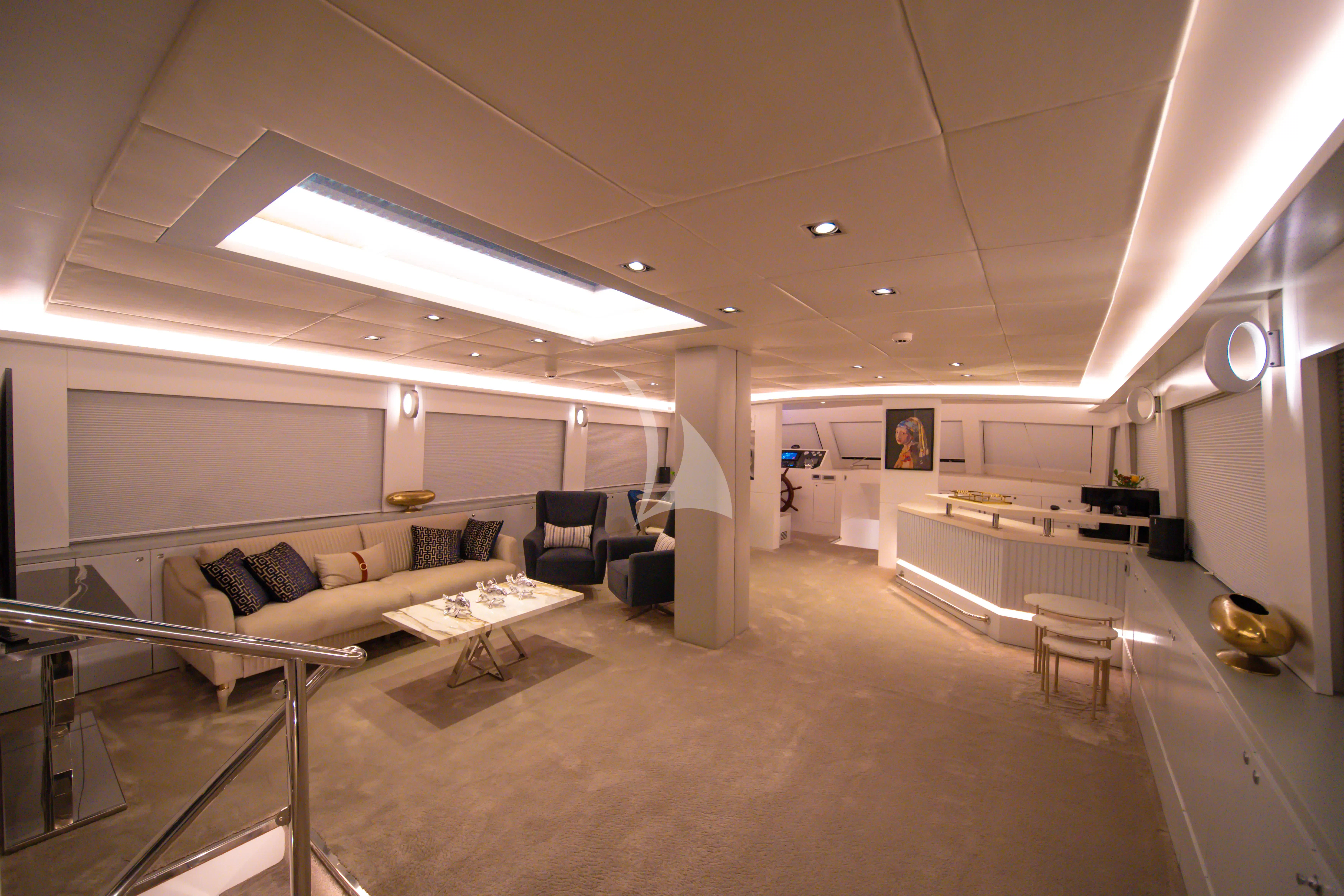 a room with a couch and a table aboard DOUBLE EAGLE Yacht for Sale