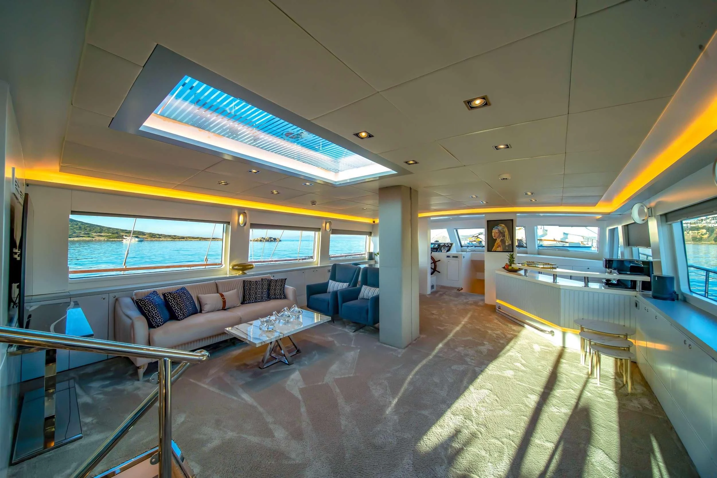 a large room with a couch and a table aboard DOUBLE EAGLE Yacht for Sale