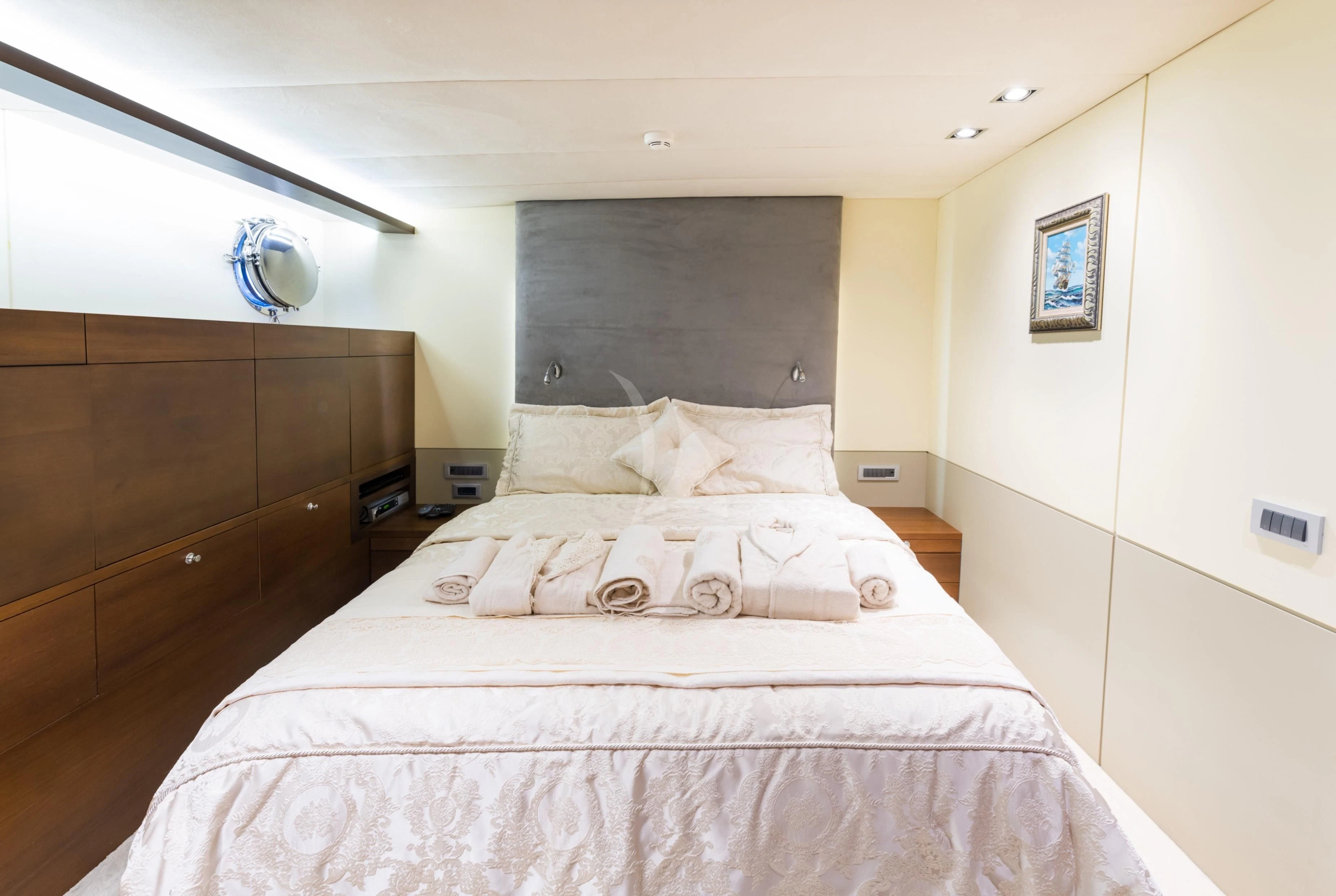 a bed with a pink comforter aboard DOUBLE EAGLE Yacht for Sale