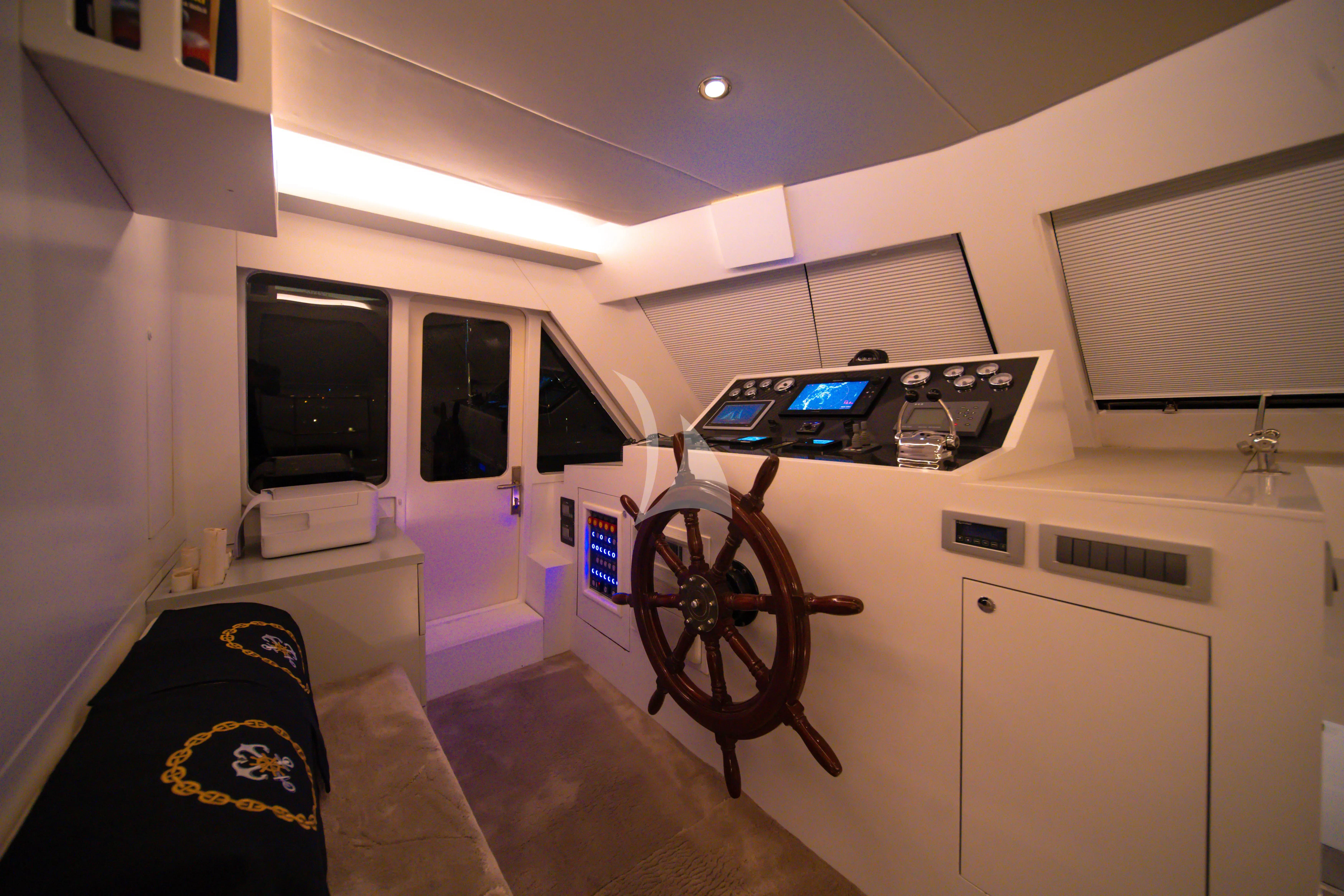 a room with a fan and a television aboard DOUBLE EAGLE Yacht for Sale