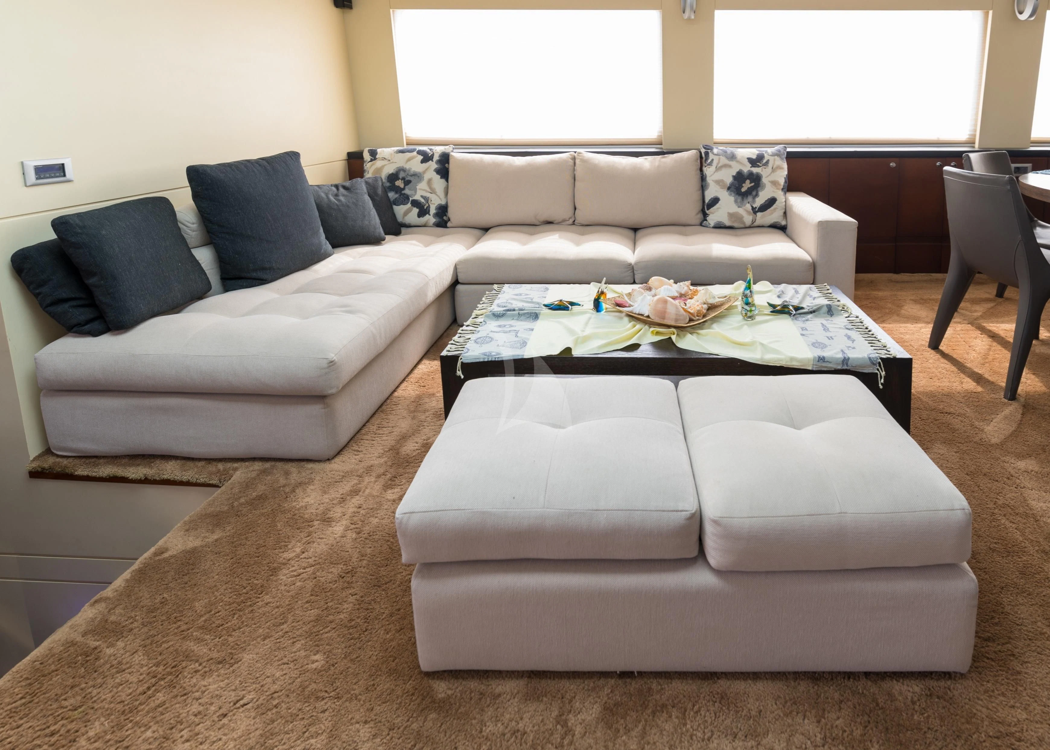 a couch with a coffee table aboard DOUBLE EAGLE Yacht for Sale