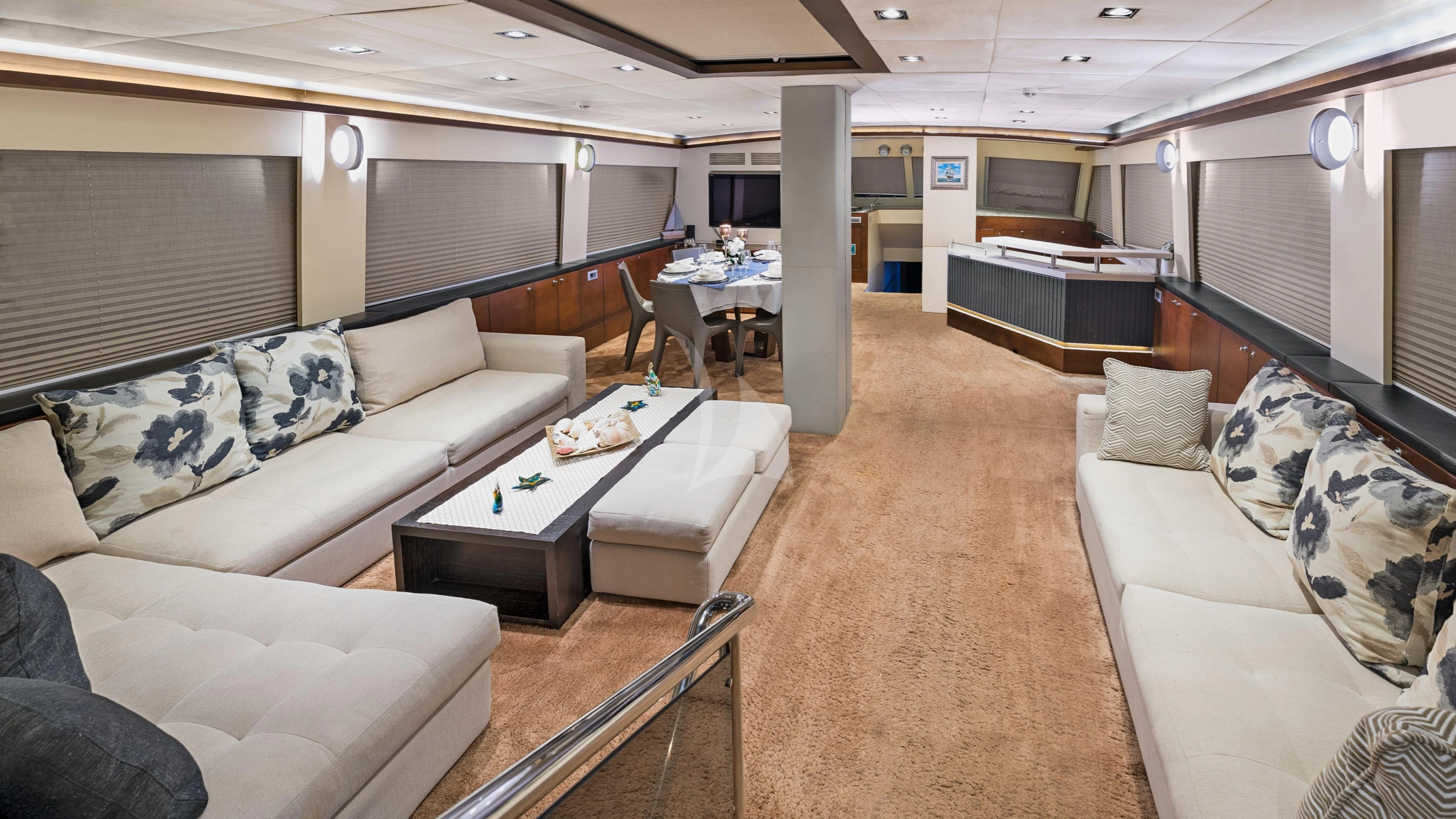 a living room with a couch and a coffee table aboard DOUBLE EAGLE Yacht for Sale