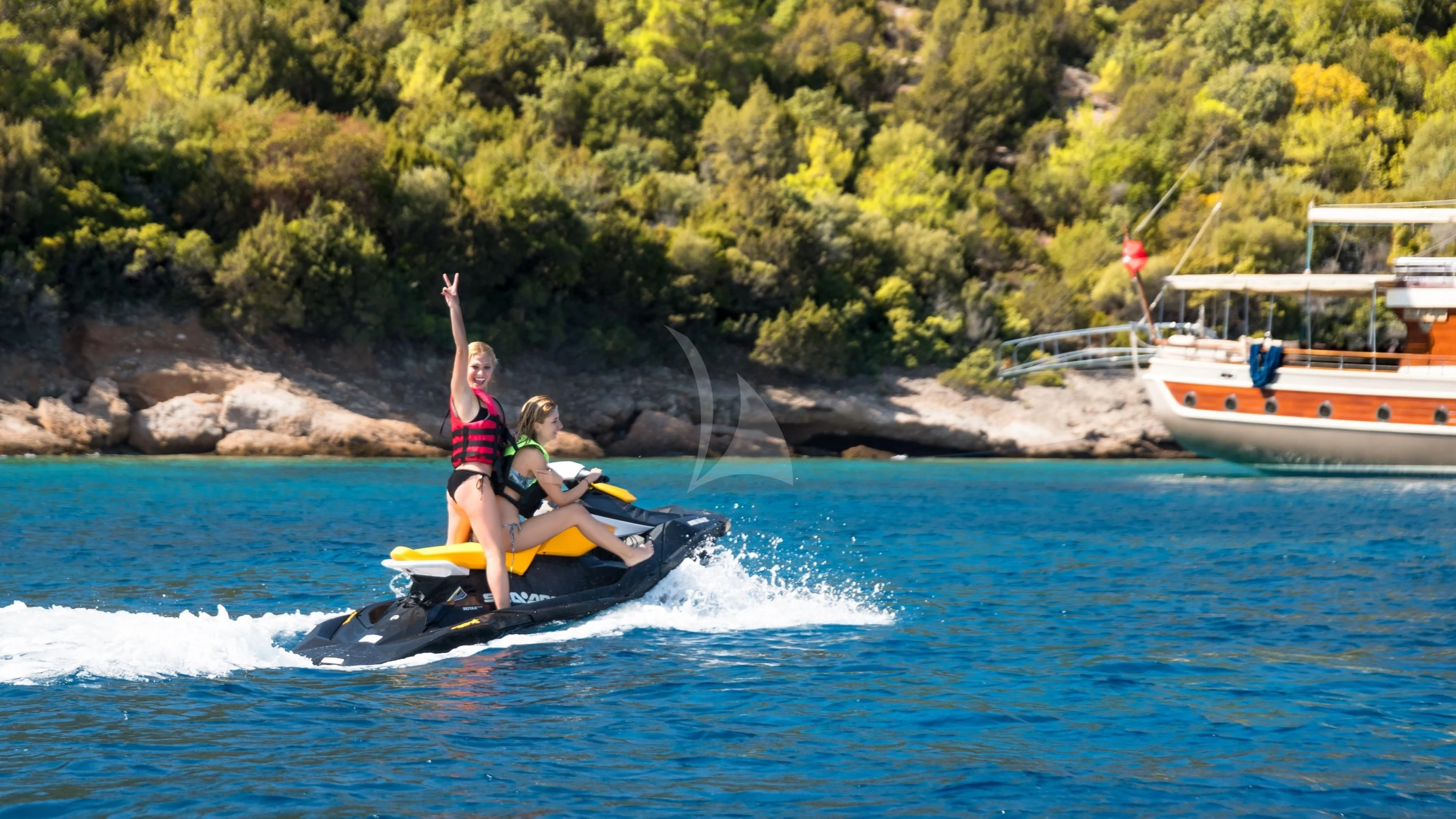 a couple of people on a paddle boat in the water aboard DOUBLE EAGLE Yacht for Sale