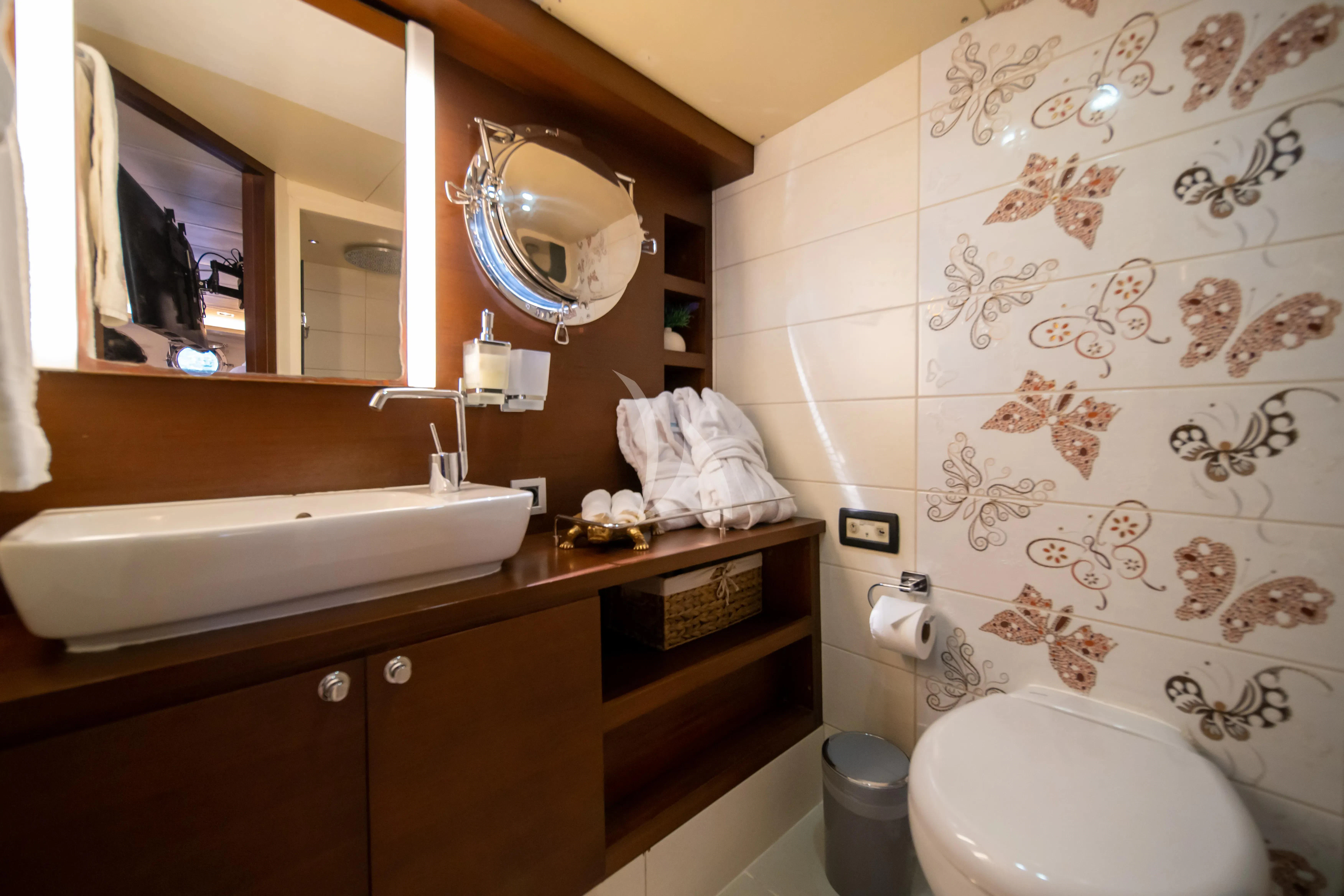 a bathroom with a sink and toilet aboard DOUBLE EAGLE Yacht for Sale