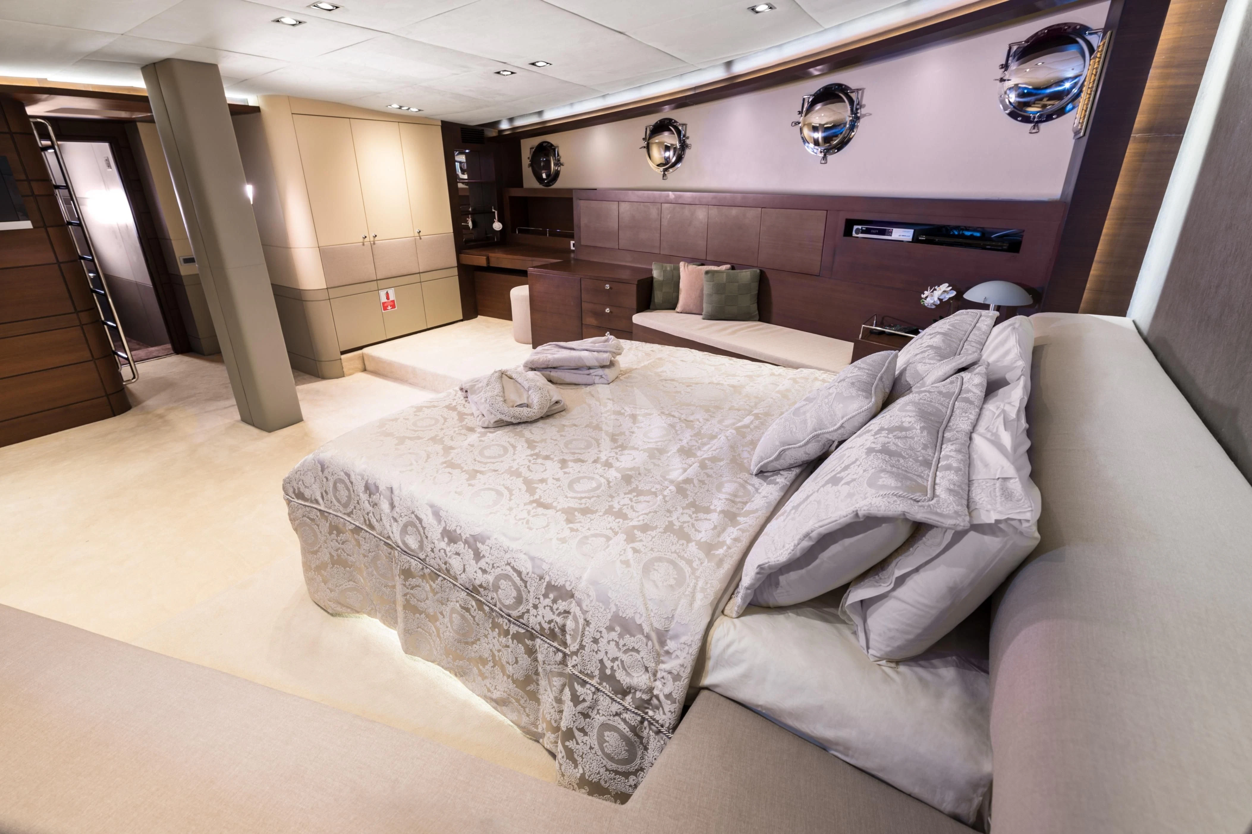 a bed with white sheets aboard DOUBLE EAGLE Yacht for Sale