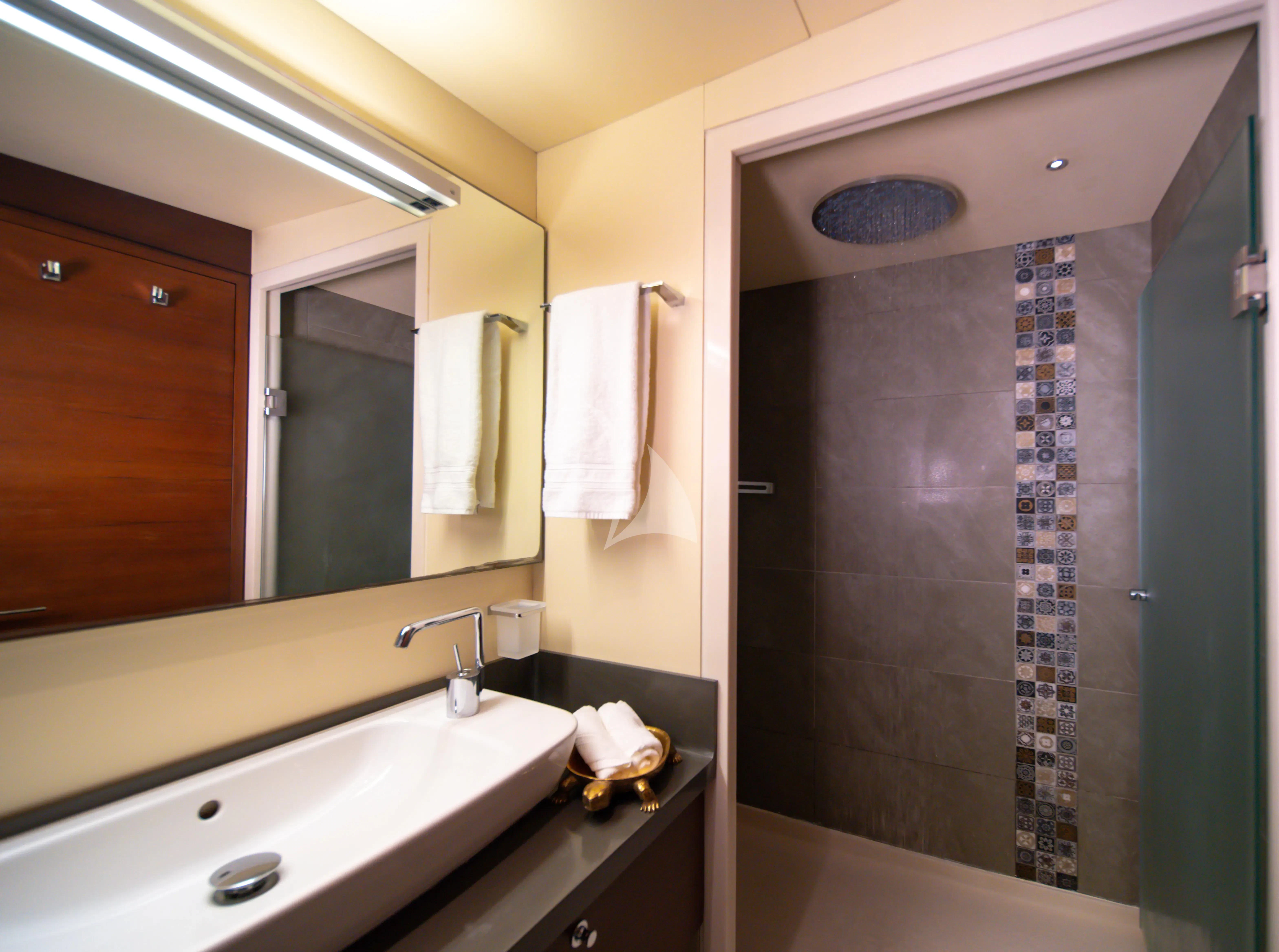 a bathroom with a shower unit and sink aboard DOUBLE EAGLE Yacht for Sale