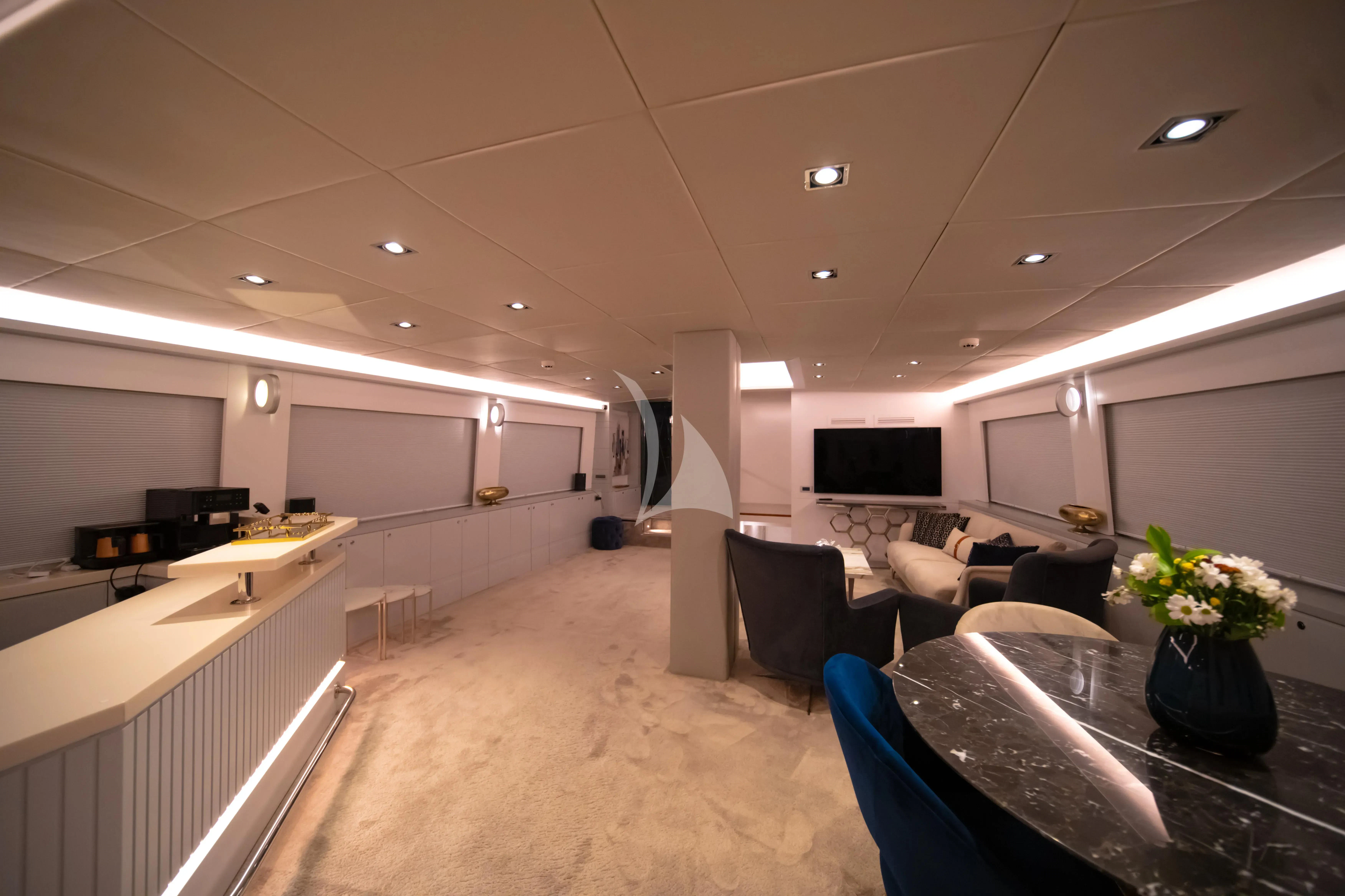 a room with a couch and a television aboard DOUBLE EAGLE Yacht for Sale