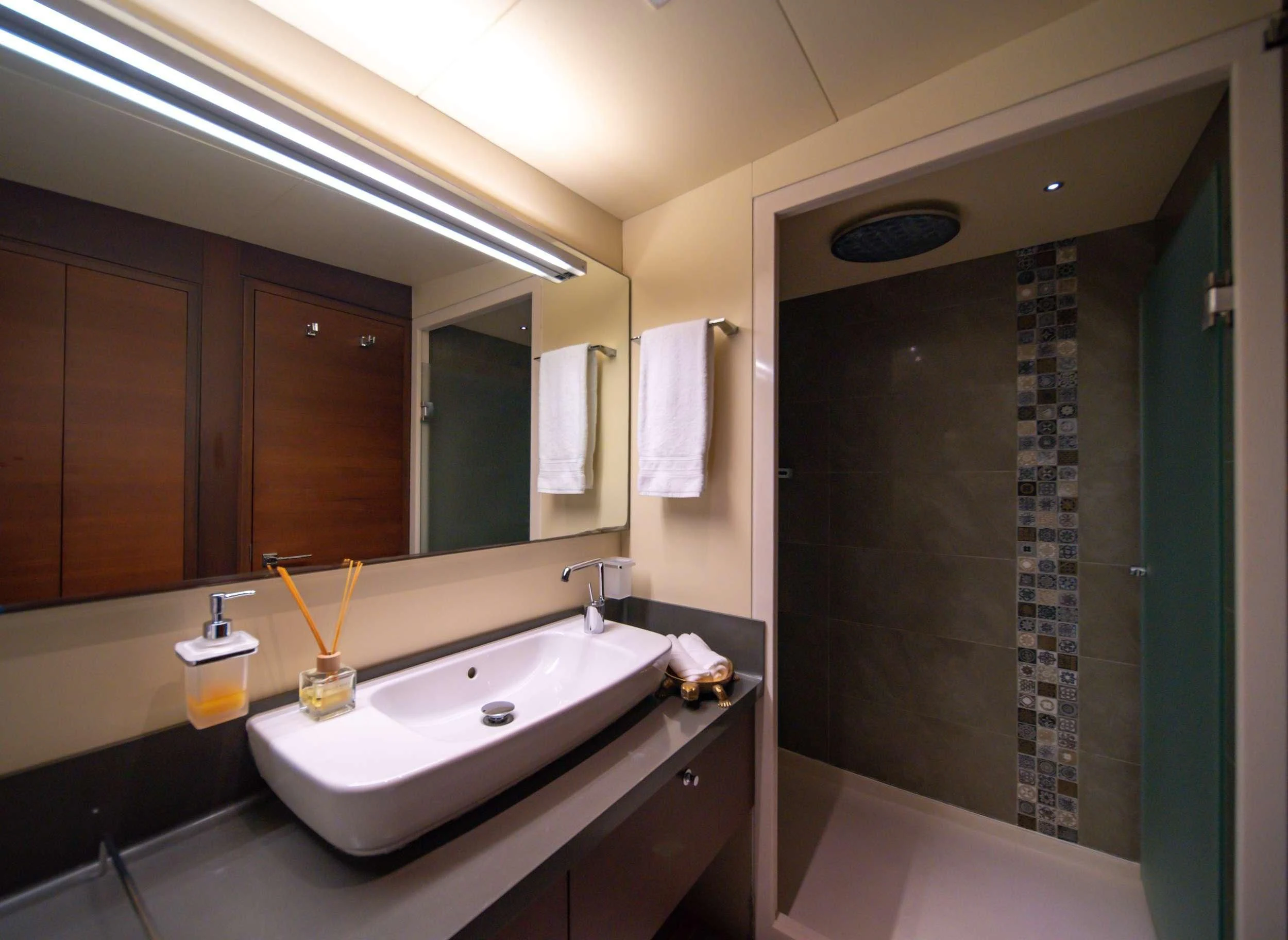a bathroom with a sink and a shower aboard DOUBLE EAGLE Yacht for Sale