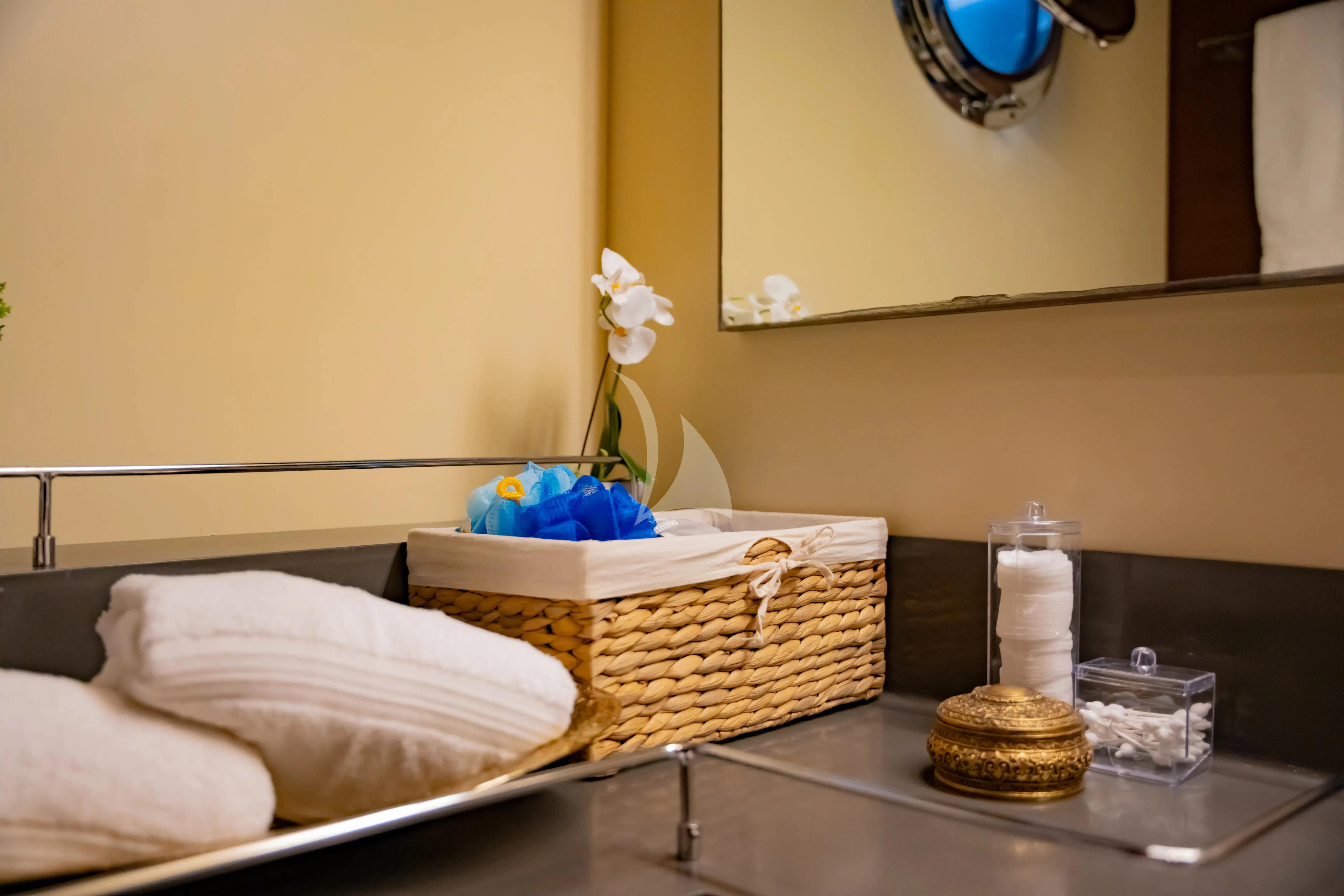 a bed with a basket of food aboard DOUBLE EAGLE Yacht for Sale