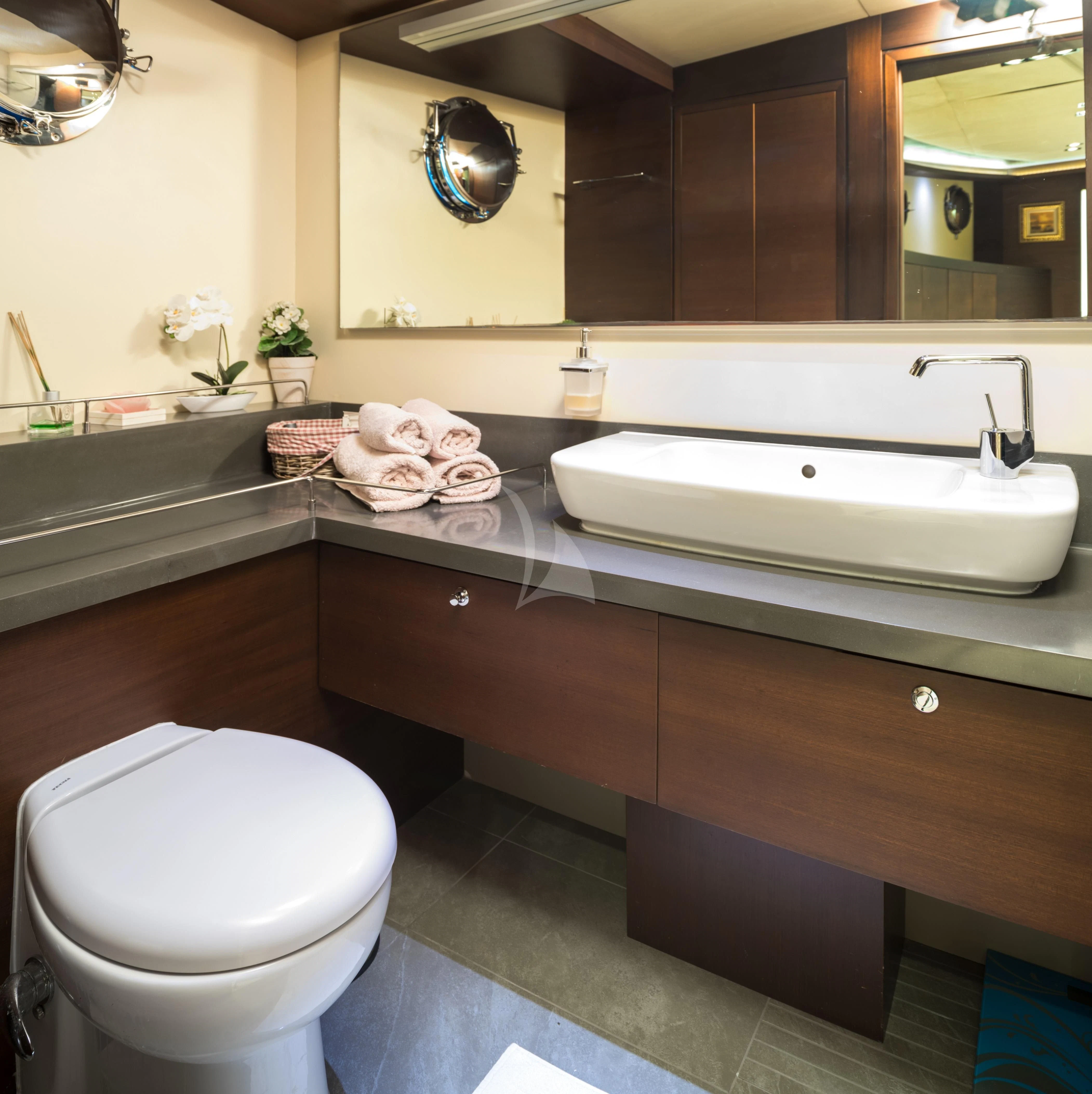 a bathroom with a tub sink and toilet aboard DOUBLE EAGLE Yacht for Sale