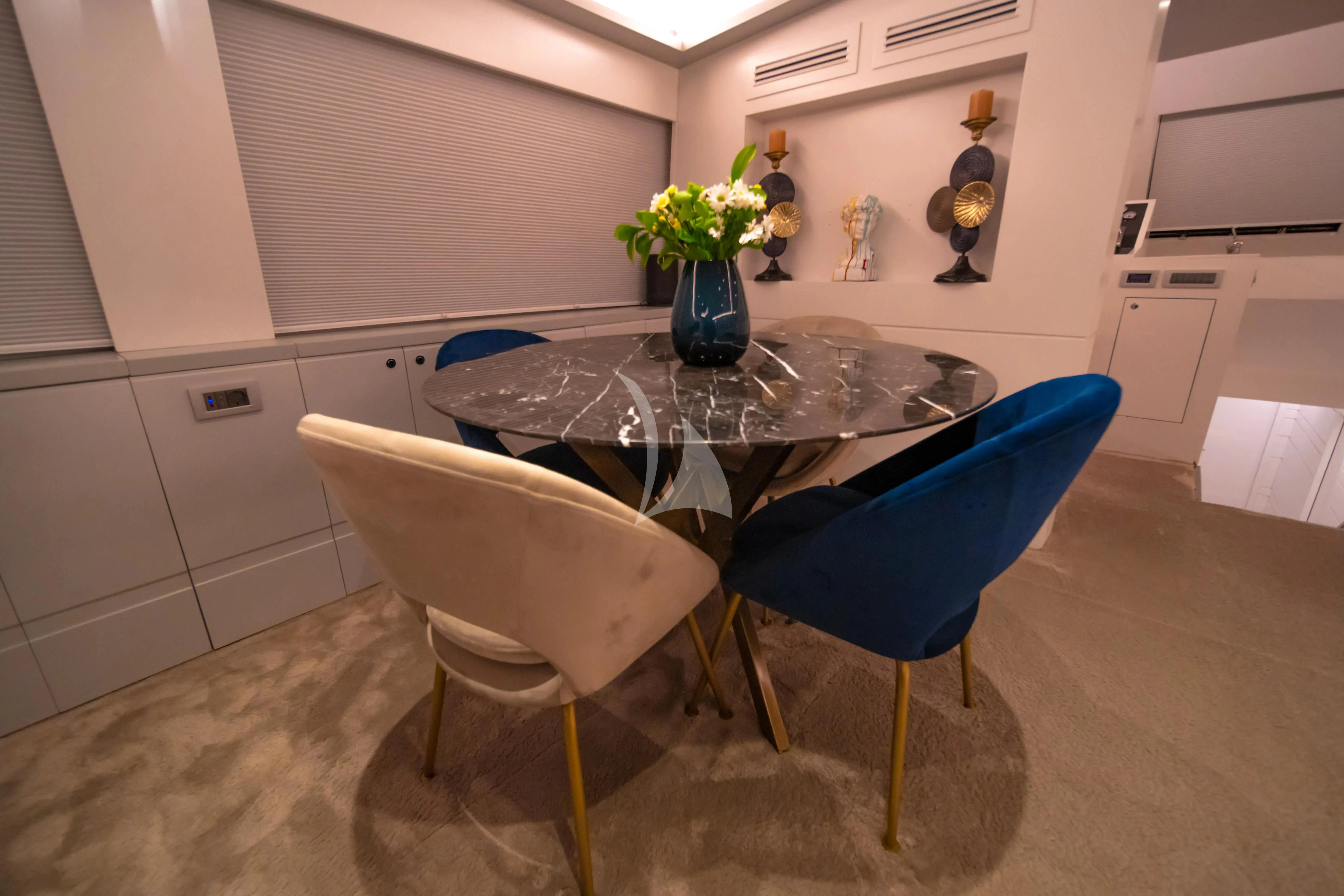 a table and chairs in a kitchen aboard DOUBLE EAGLE Yacht for Sale