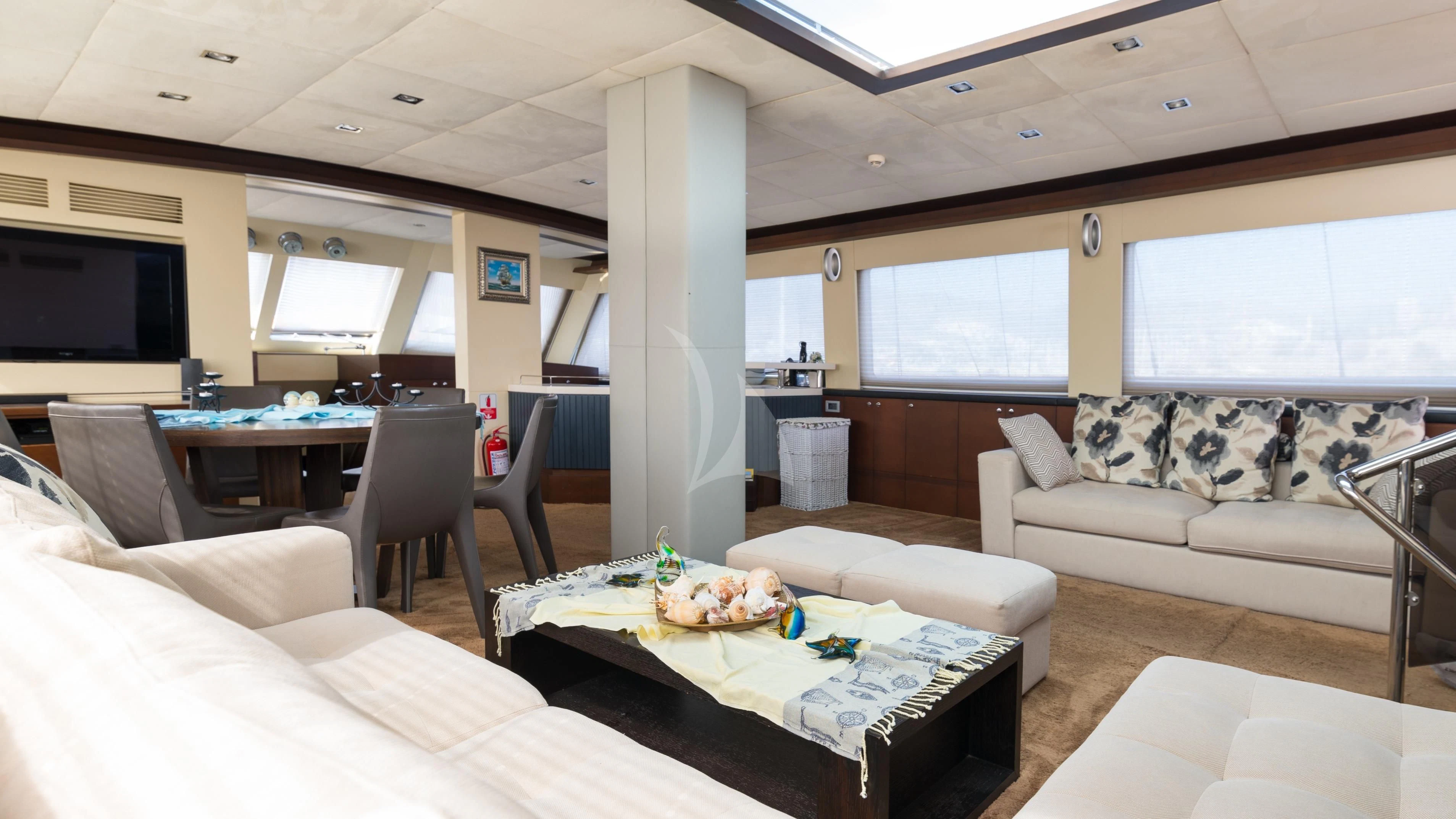 a living room with a couch and a table aboard DOUBLE EAGLE Yacht for Sale