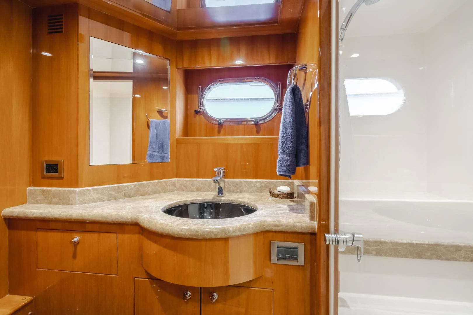 a bathroom with a sink and a mirror aboard OBSESSION Yacht for Sale