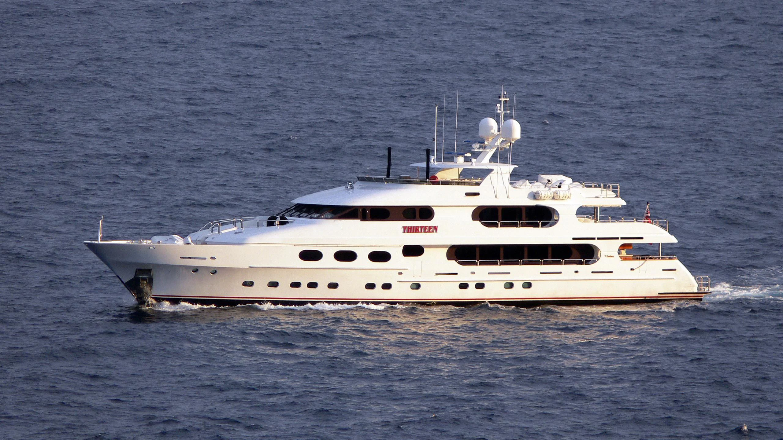 a white boat in the water aboard CRILI Yacht for Sale