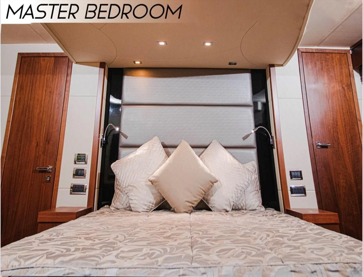 a bed with white pillows aboard FARA Yacht for Sale