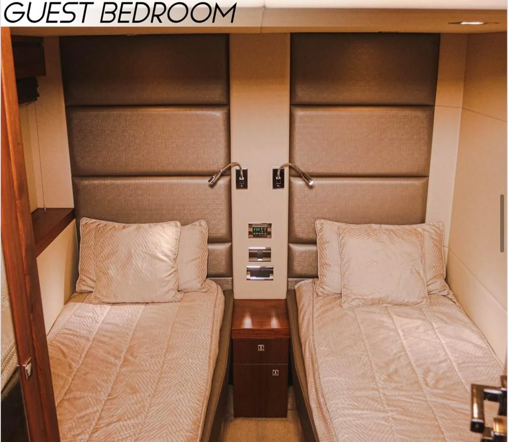 a room with two beds aboard FARA Yacht for Sale