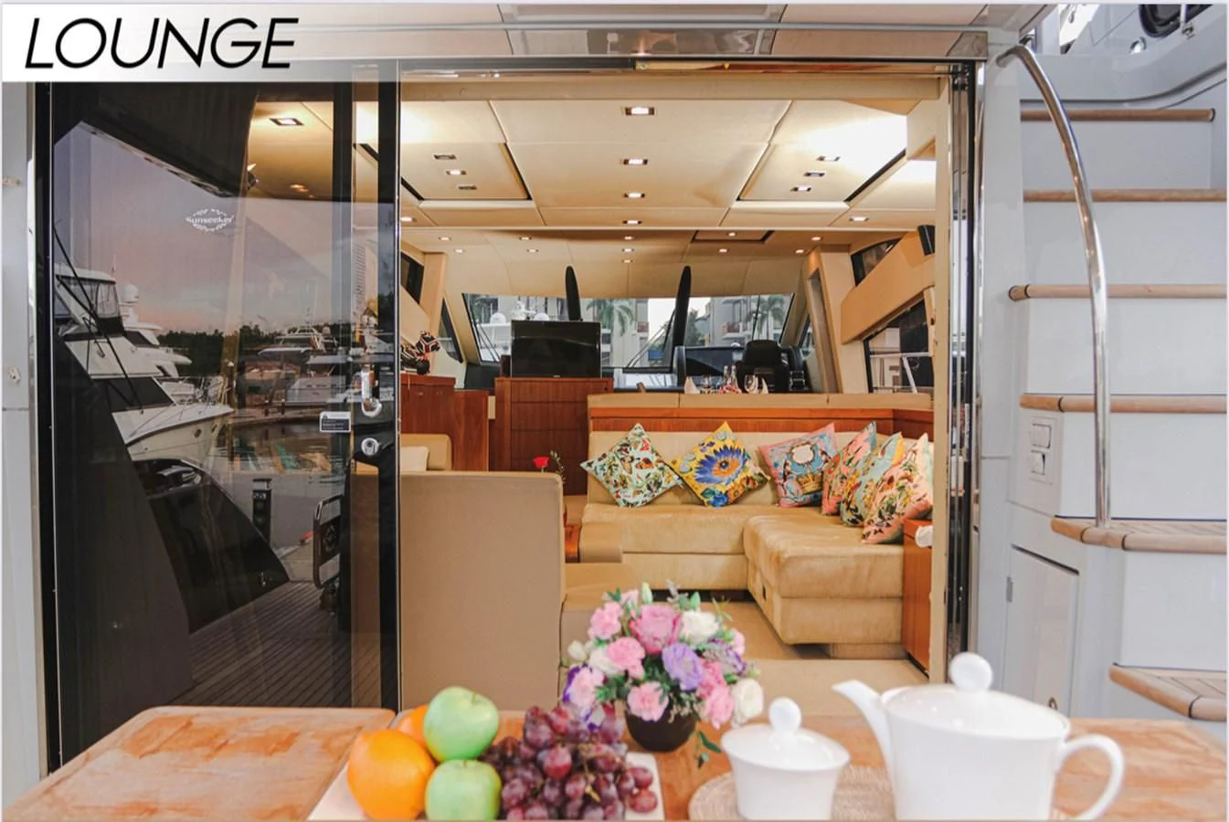 a room with a couch and coffee table aboard FARA Yacht for Sale