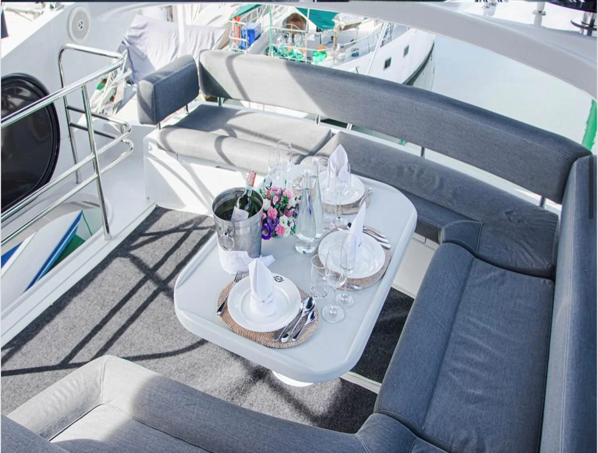 a table with glasses and plates on it aboard FARA Yacht for Sale