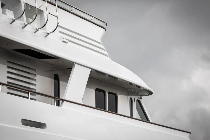 a white building with a staircase aboard VALORIA B Yacht for Sale