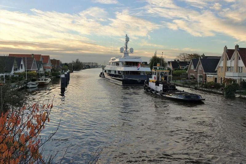 a body of water with boats and houses along it aboard VALORIA B Yacht for Sale