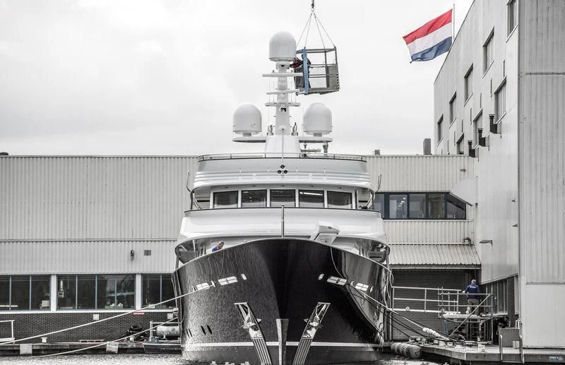 a large ship docked in front of a building aboard VALORIA B Yacht for Sale