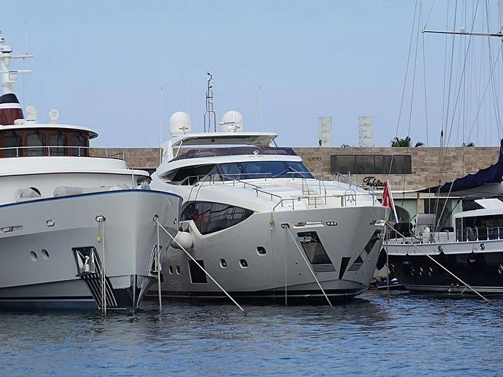 several boats docked at a pier aboard HAPPY 2 Yacht for Sale