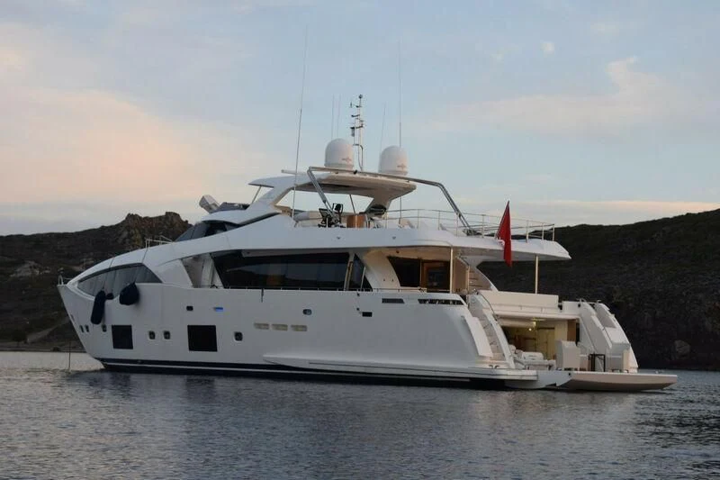 a large white boat in the water aboard HAPPY 2 Yacht for Sale