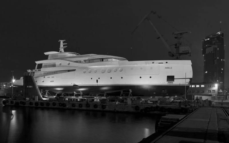 a large ship docked aboard EVENT Yacht for Sale