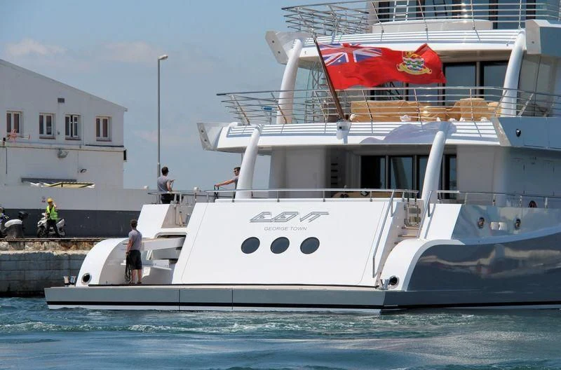 a boat with a flag on the front aboard EVENT Yacht for Sale