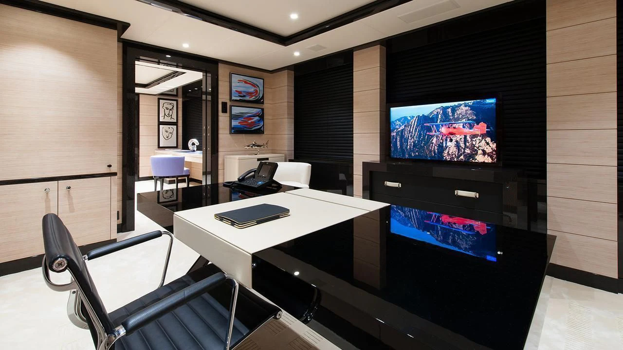 a room with a table and chairs aboard EVENT Yacht for Sale