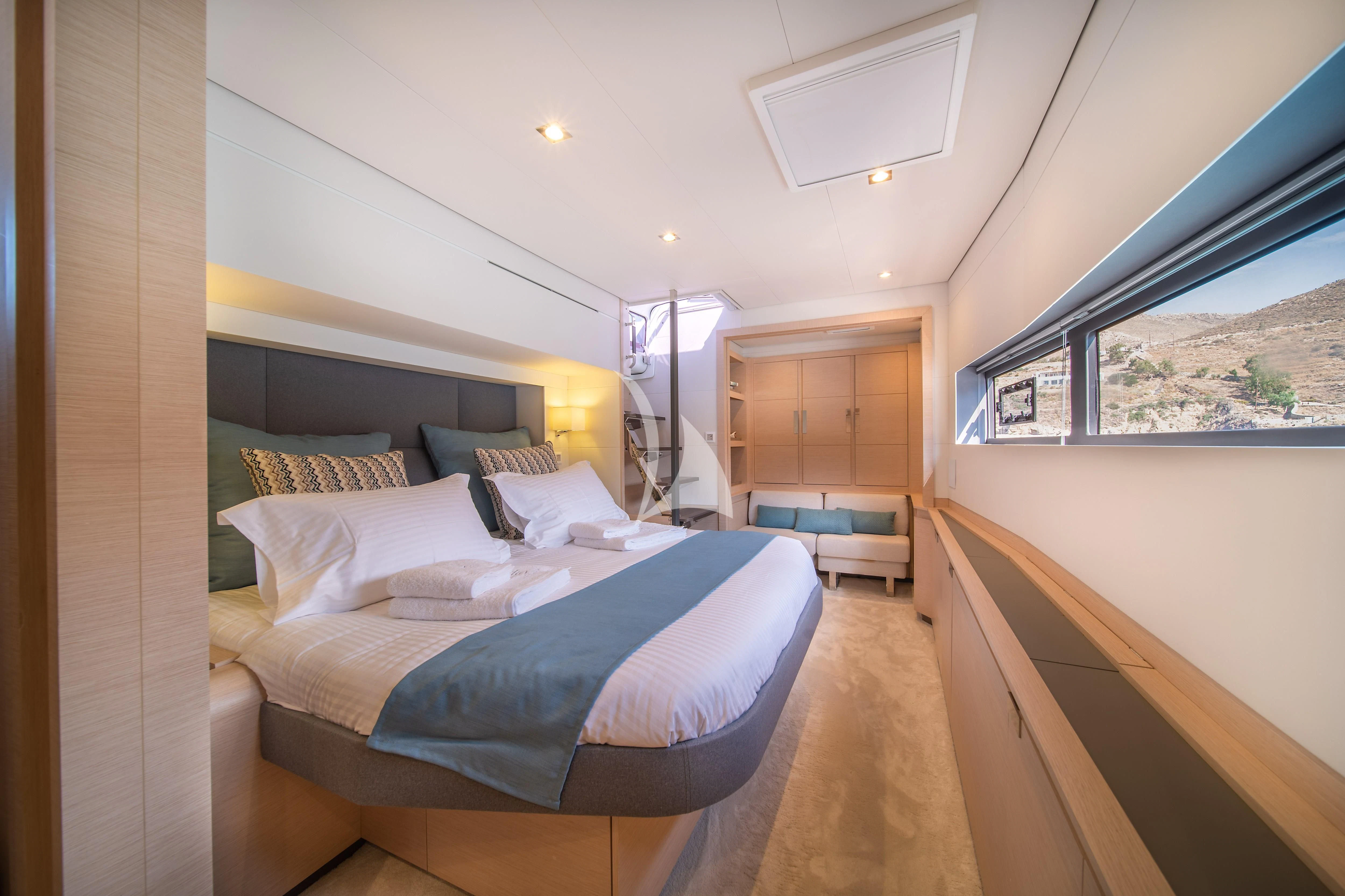 a room with two beds aboard AETHER Yacht for Charter