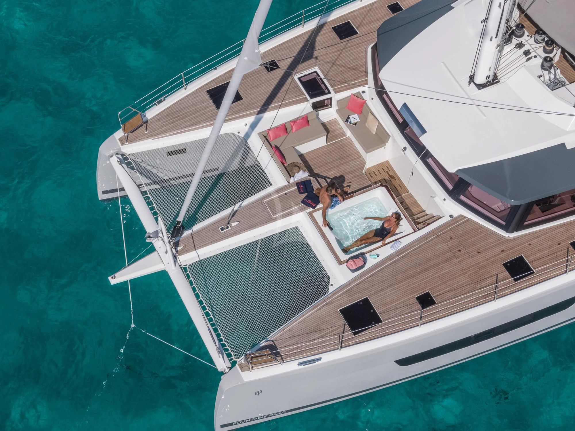 a group of people on a boat aboard AETHER Yacht for Charter