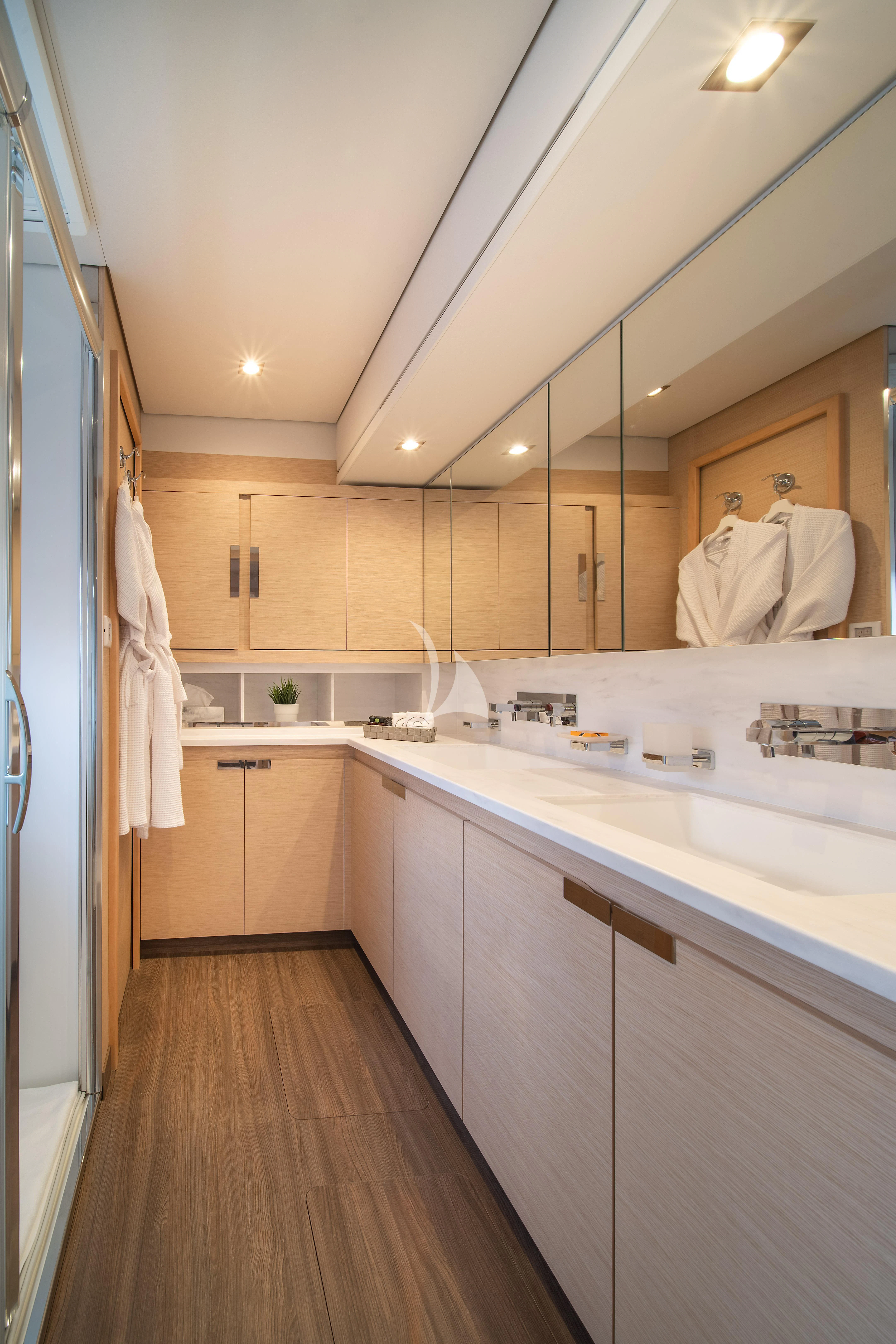 a bathroom with a large mirror aboard AETHER Yacht for Charter