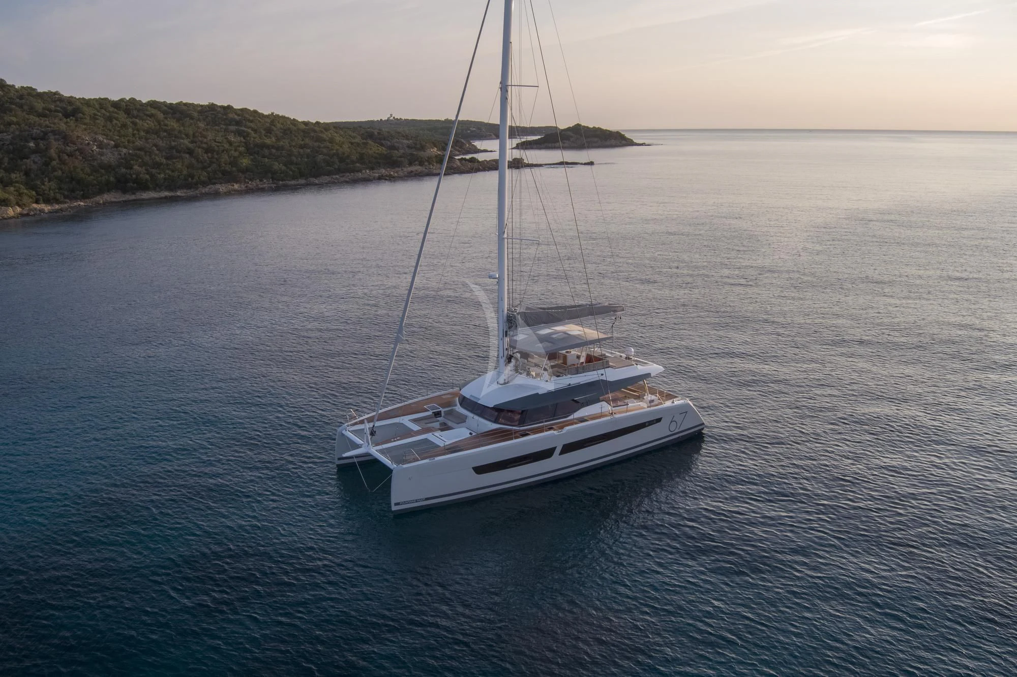 a white boat in the water aboard AETHER Yacht for Charter