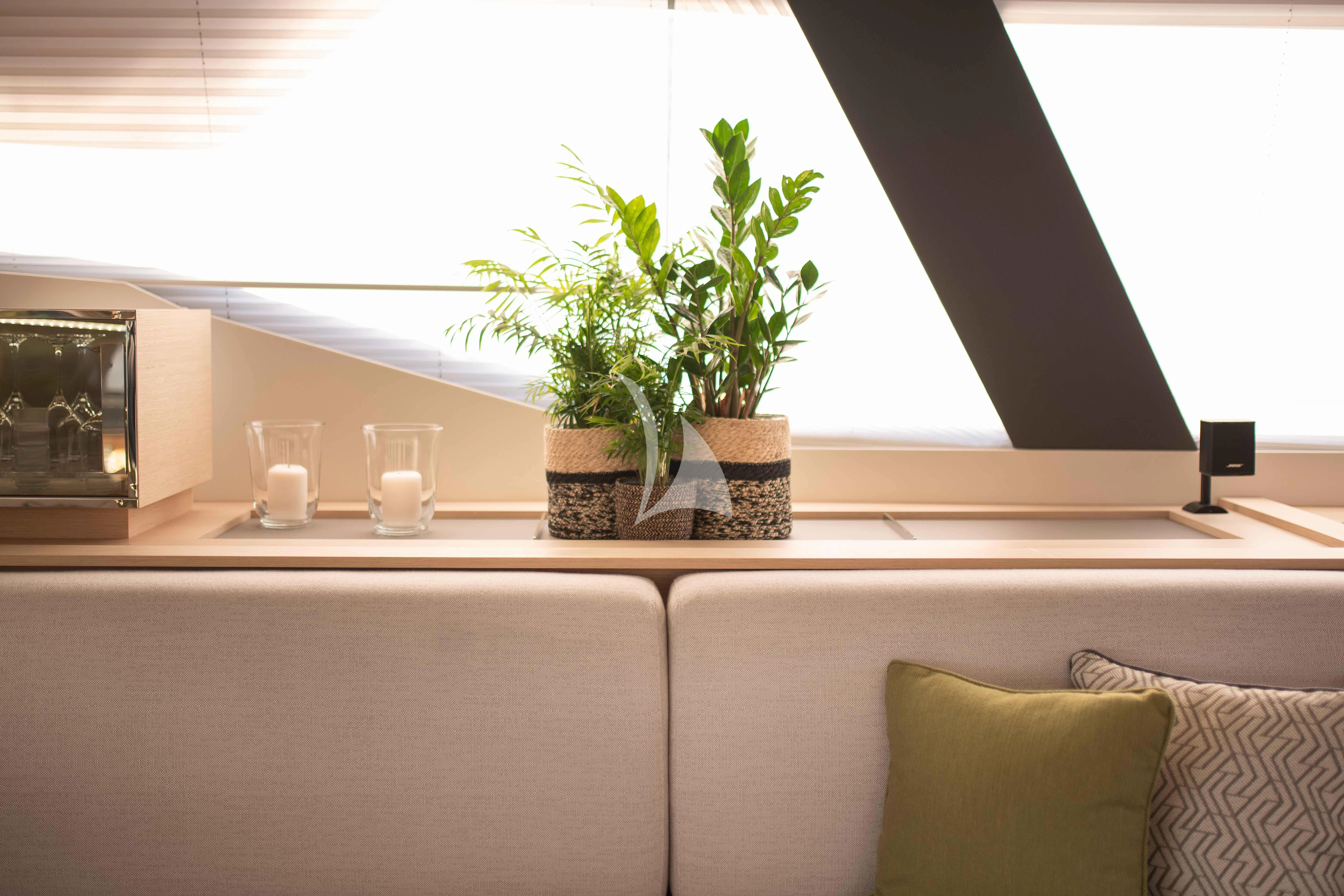 a plant in a pot on a table aboard AETHER Yacht for Charter