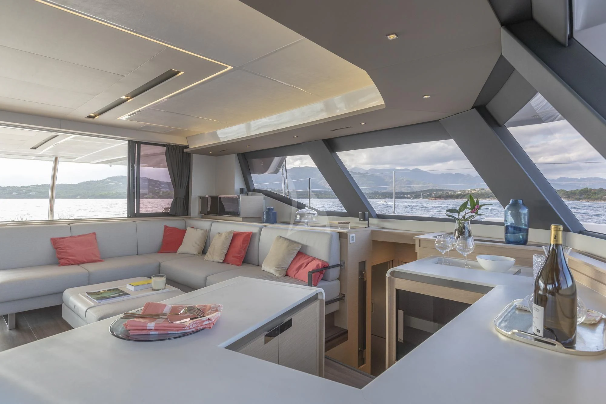 a living room with a large glass window aboard AETHER Yacht for Charter