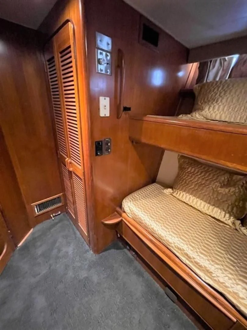 a room with bunk beds aboard MR. ED Yacht for Sale