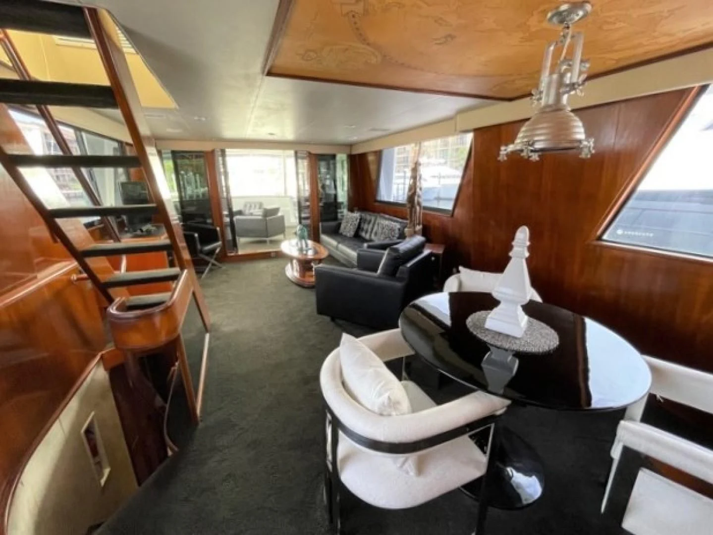 a room with a couch and a piano aboard MR. ED Yacht for Sale
