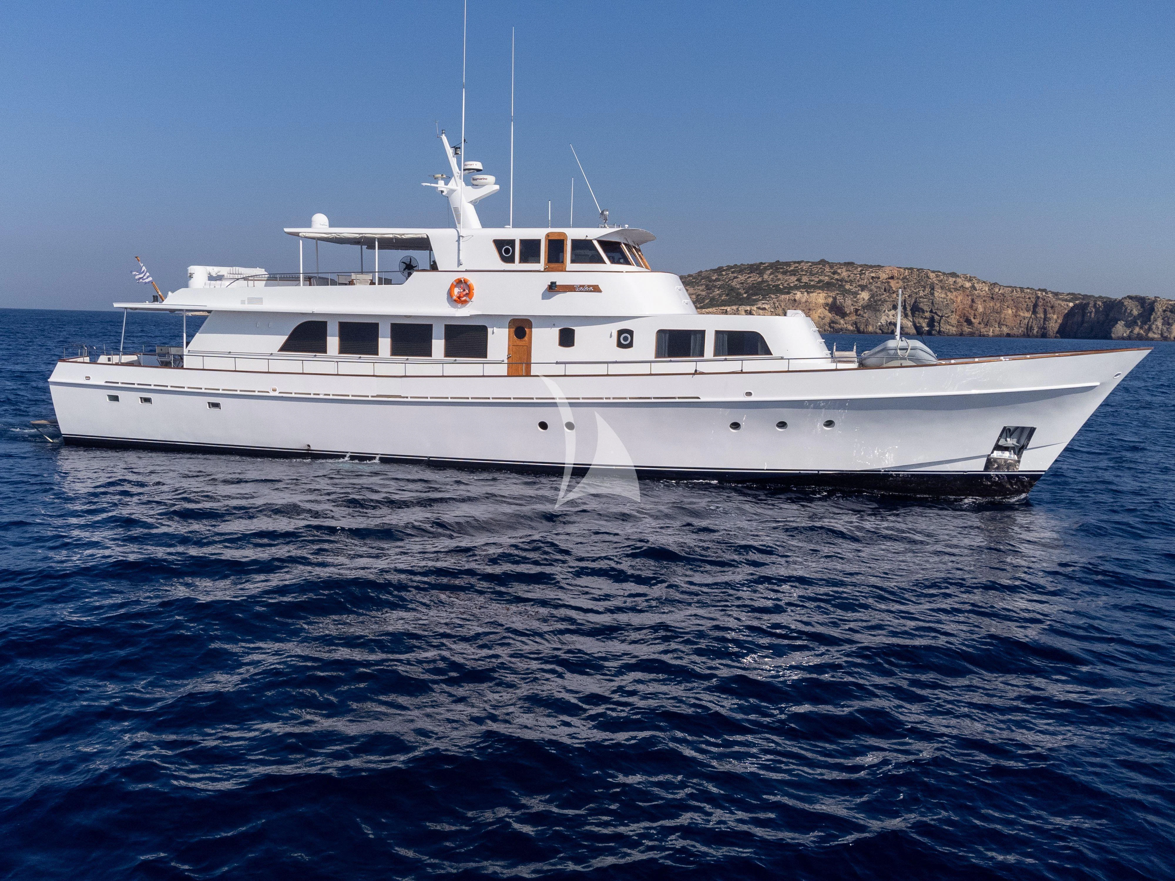 a white yacht in the water aboard TAKA Yacht for Sale