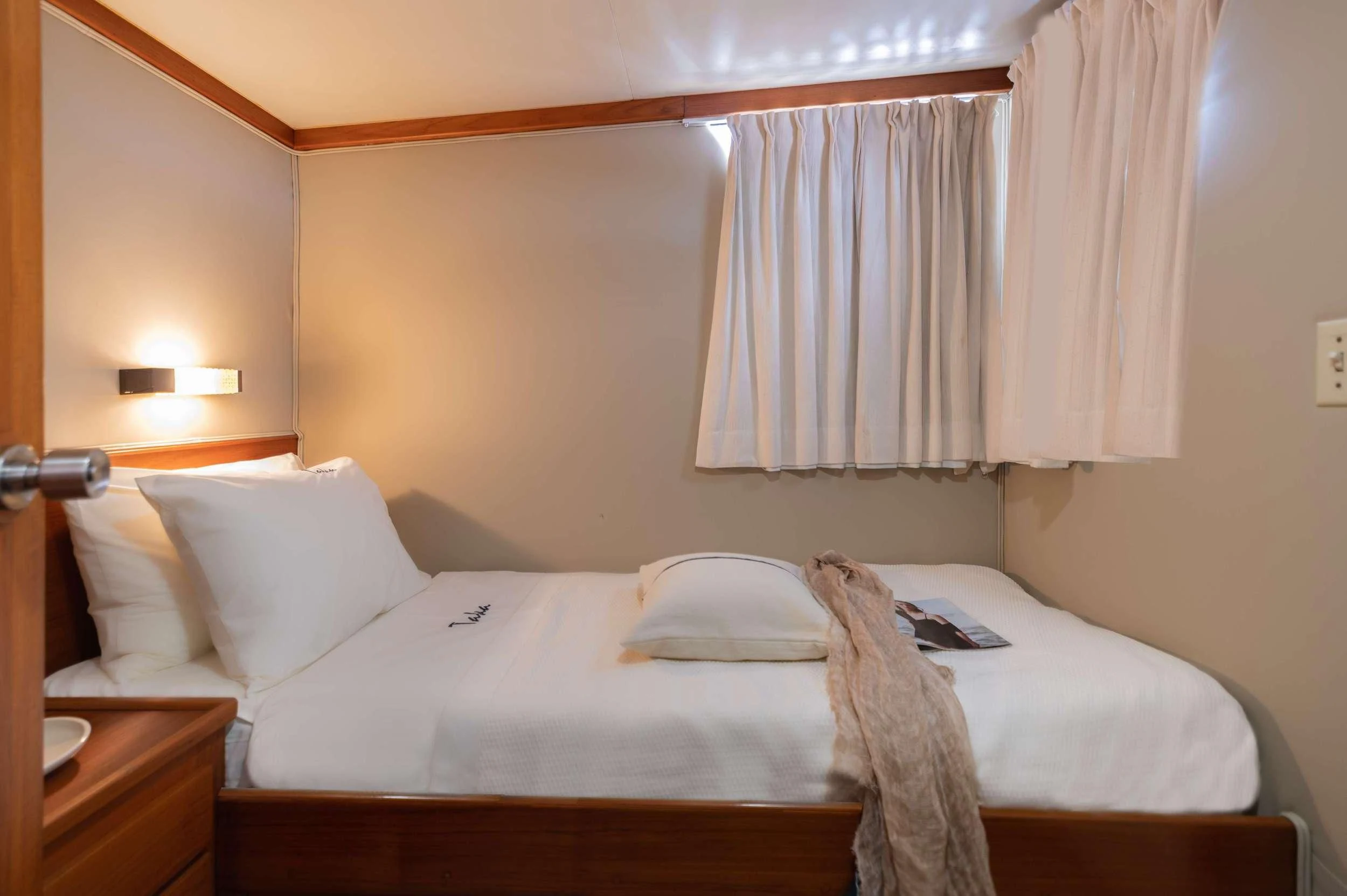 a hotel room with a bed aboard TAKA Yacht for Sale