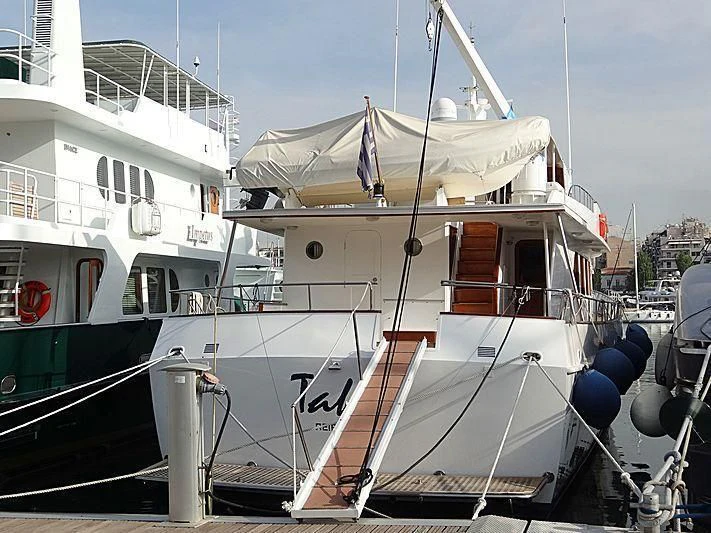 a boat docked at a pier aboard TAKA Yacht for Sale