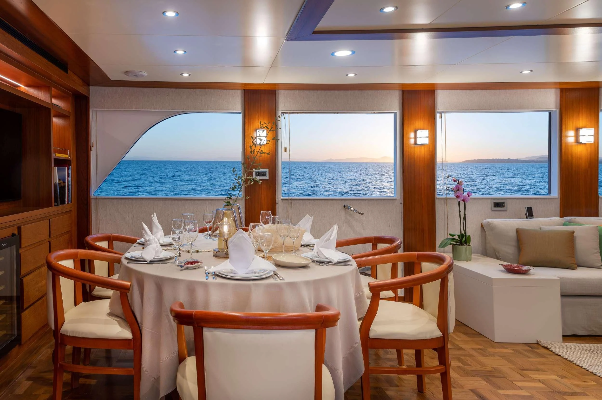 a dining room with a table and chairs aboard TAKA Yacht for Sale