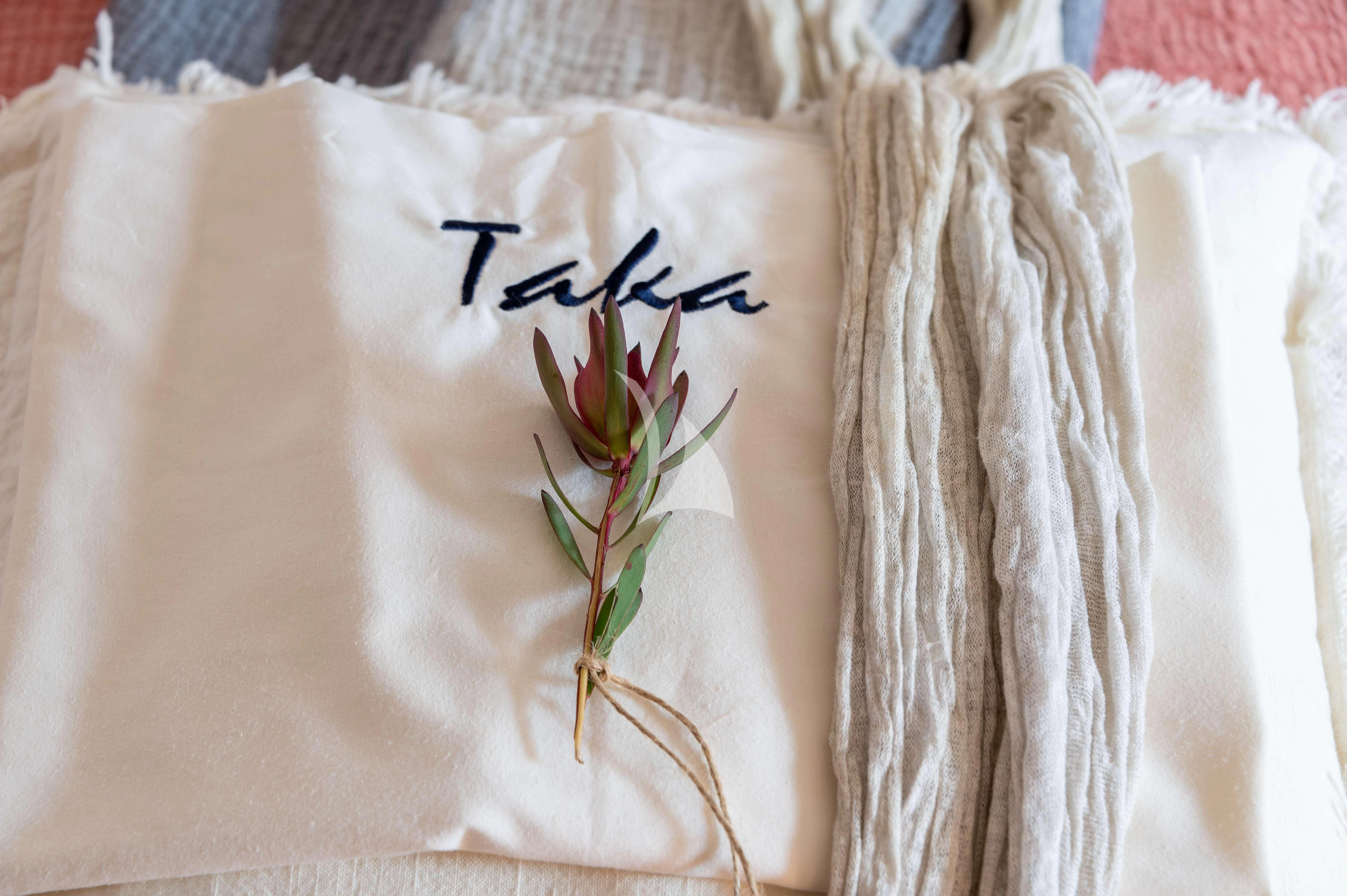 a flower on a person's shirt aboard TAKA Yacht for Sale