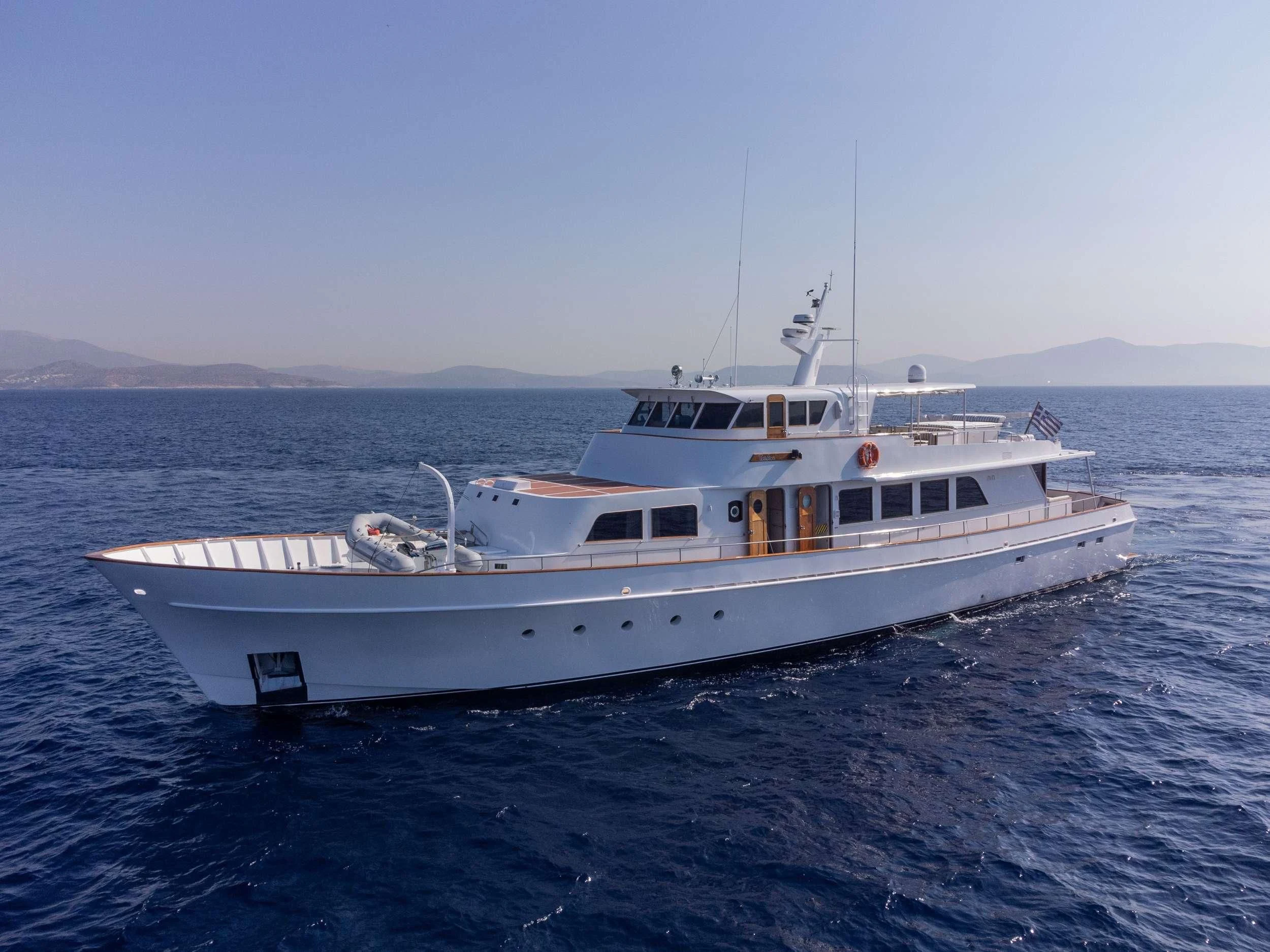 a white boat in the water aboard TAKA Yacht for Sale