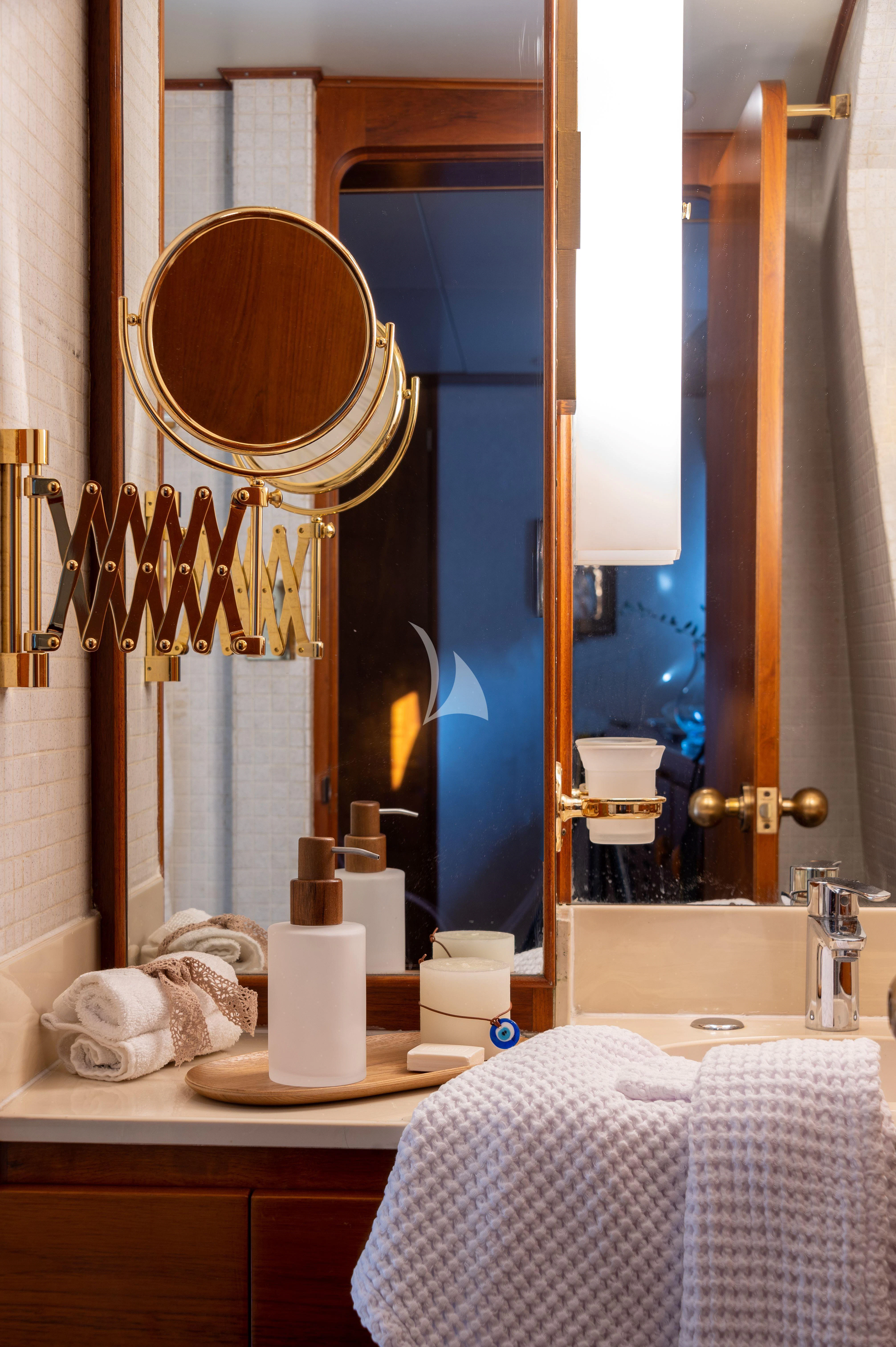a bathroom with a large mirror aboard TAKA Yacht for Sale